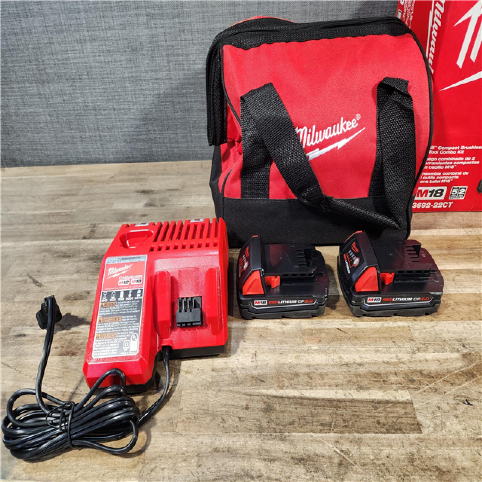 HOUSTON LOCATION - AS-IS Milwaukee M18 18V Lithium-Ion Brushless Cordless Compact Drill/Impact Combo Kit (2-Tool) W/(2) 2.0 Ah Batteries  Charger & Bag