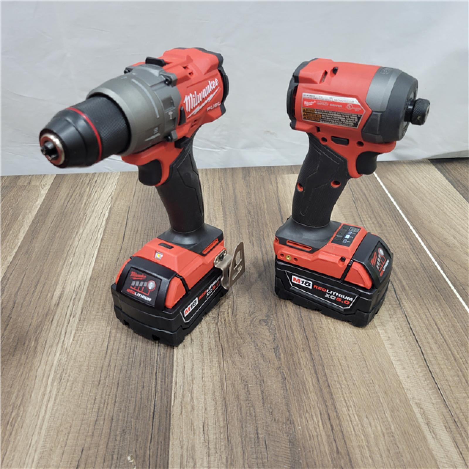 AS-IS MILWAUKEE M18 FUEL 18V Lithium-Ion Brushless Cordless Hammer Drill and Impact Driver Combo Kit (2-Tool) with 2 Batteries