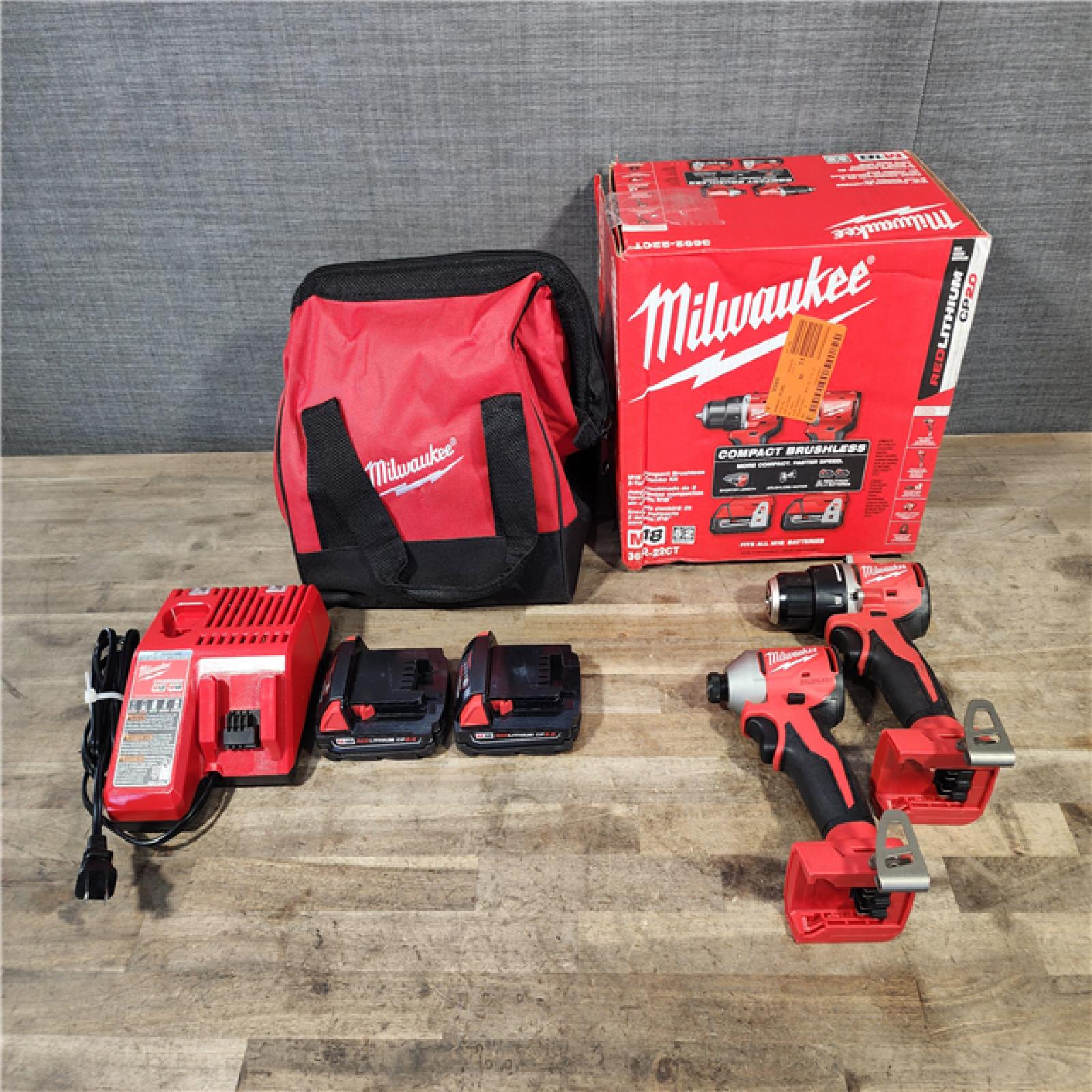 HOUSTON LOCATION - AS-IS Milwaukee M18 18V Lithium-Ion Brushless Cordless Compact Drill/Impact Combo Kit (2-Tool) W/(2) 2.0 Ah Batteries  Charger & Bag