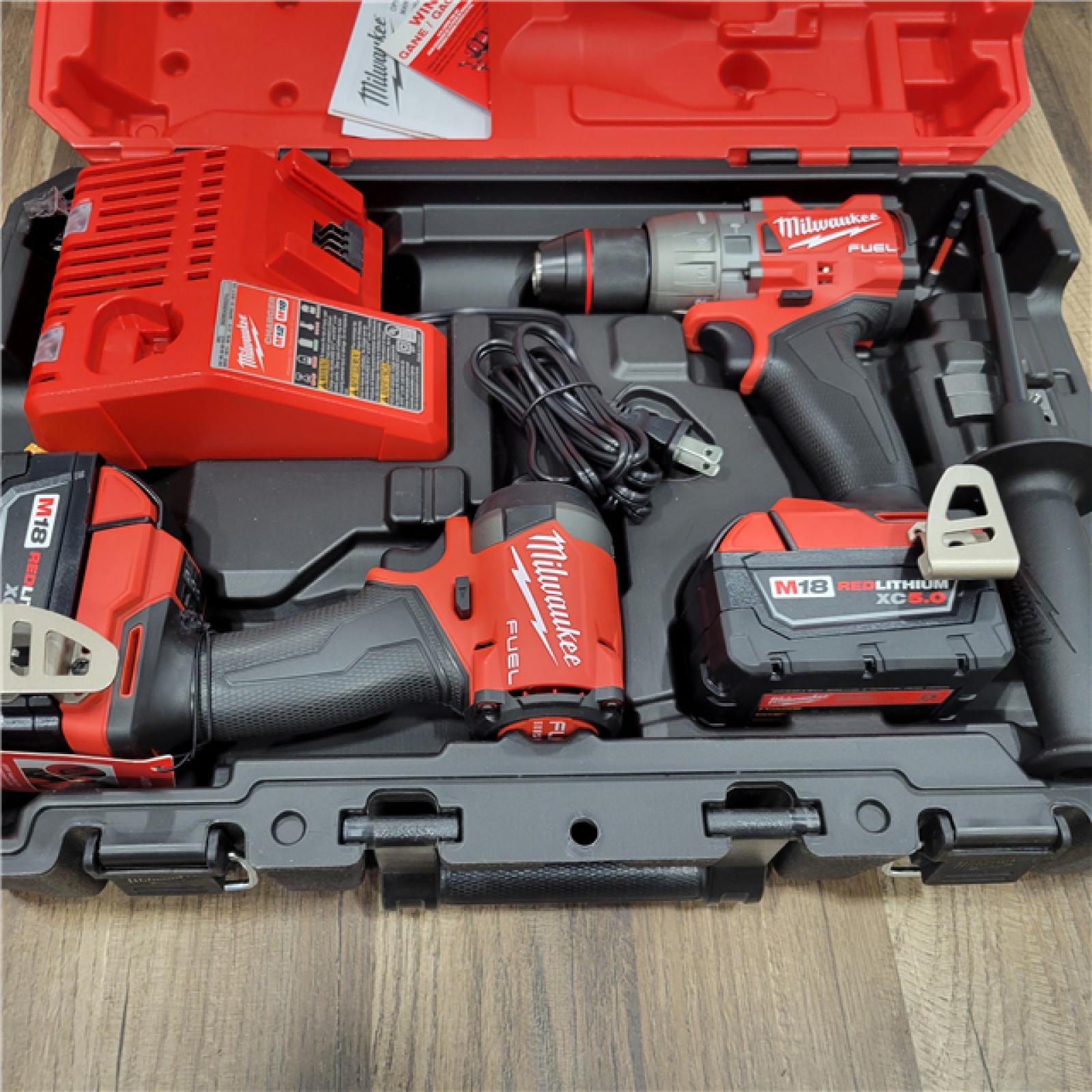 AS-IS Milwaukee M18 FUEL 18V Lithium-Ion Brushless Cordless Hammer Drill and Impact Driver Combo Kit (2-Tool) with 2 Batteries