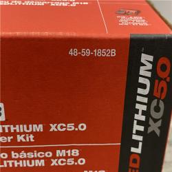 NEW - Milwaukee 18-Volt Lithium-Ion XC Starter Kit with Two 5.0Ah Batteries and Charger