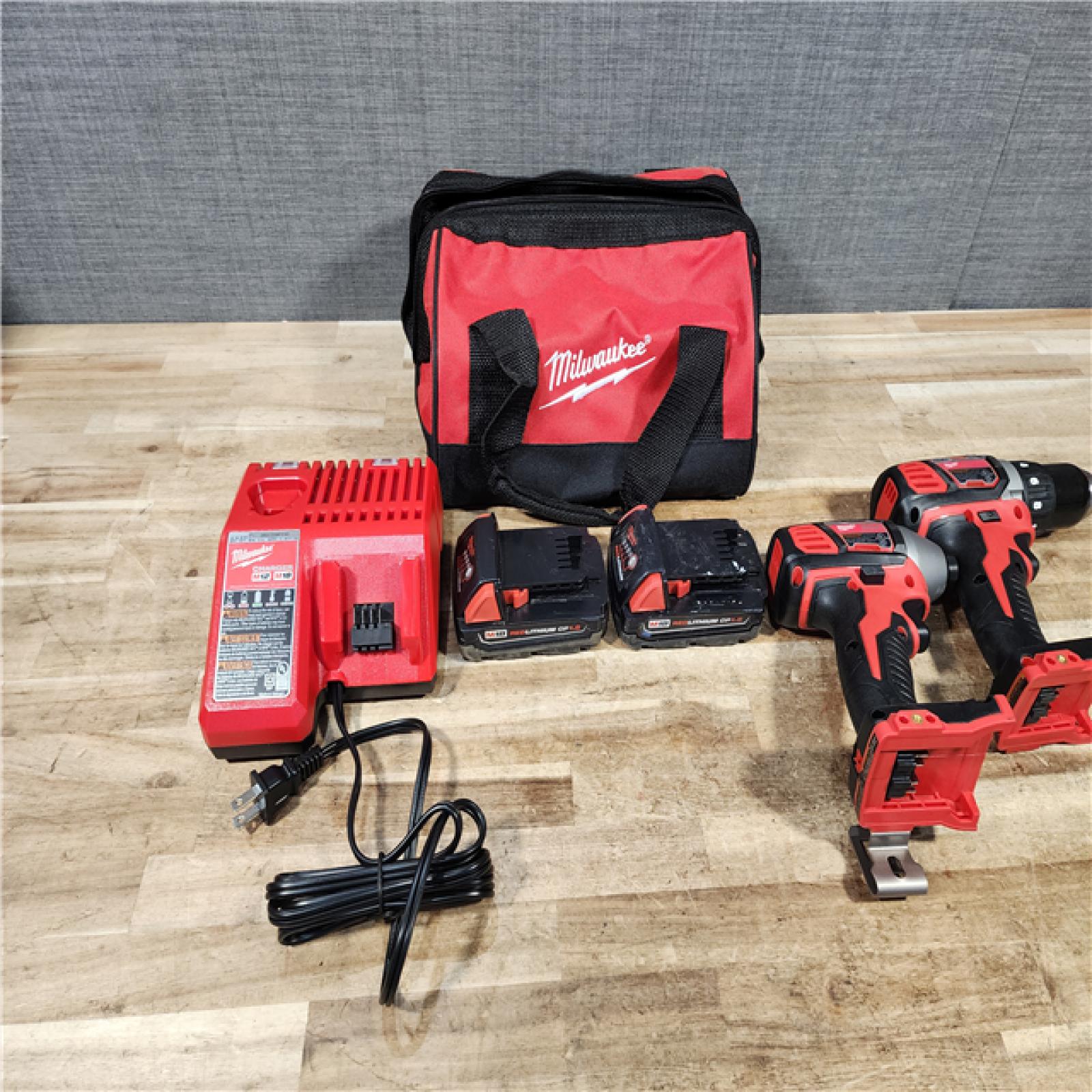 HOUSTON LOCATION - AS - IS Milwaukee 18V Lithium-Ion Cordless Drill Driver/Impact Driver Combo Kit