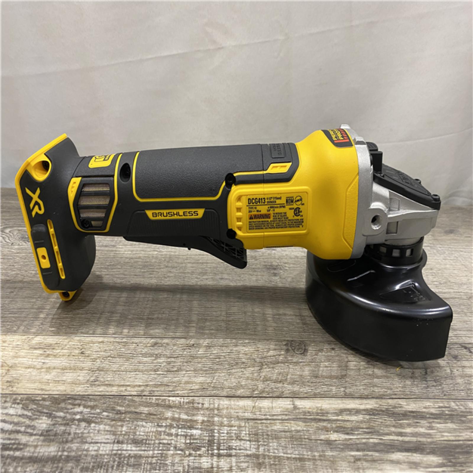 AS-IS DEWALT 20V MAX XR Cordless Brushless 4.5 in. Paddle Switch Small Angle Grinder with Kickback Brake (Tool Only)
