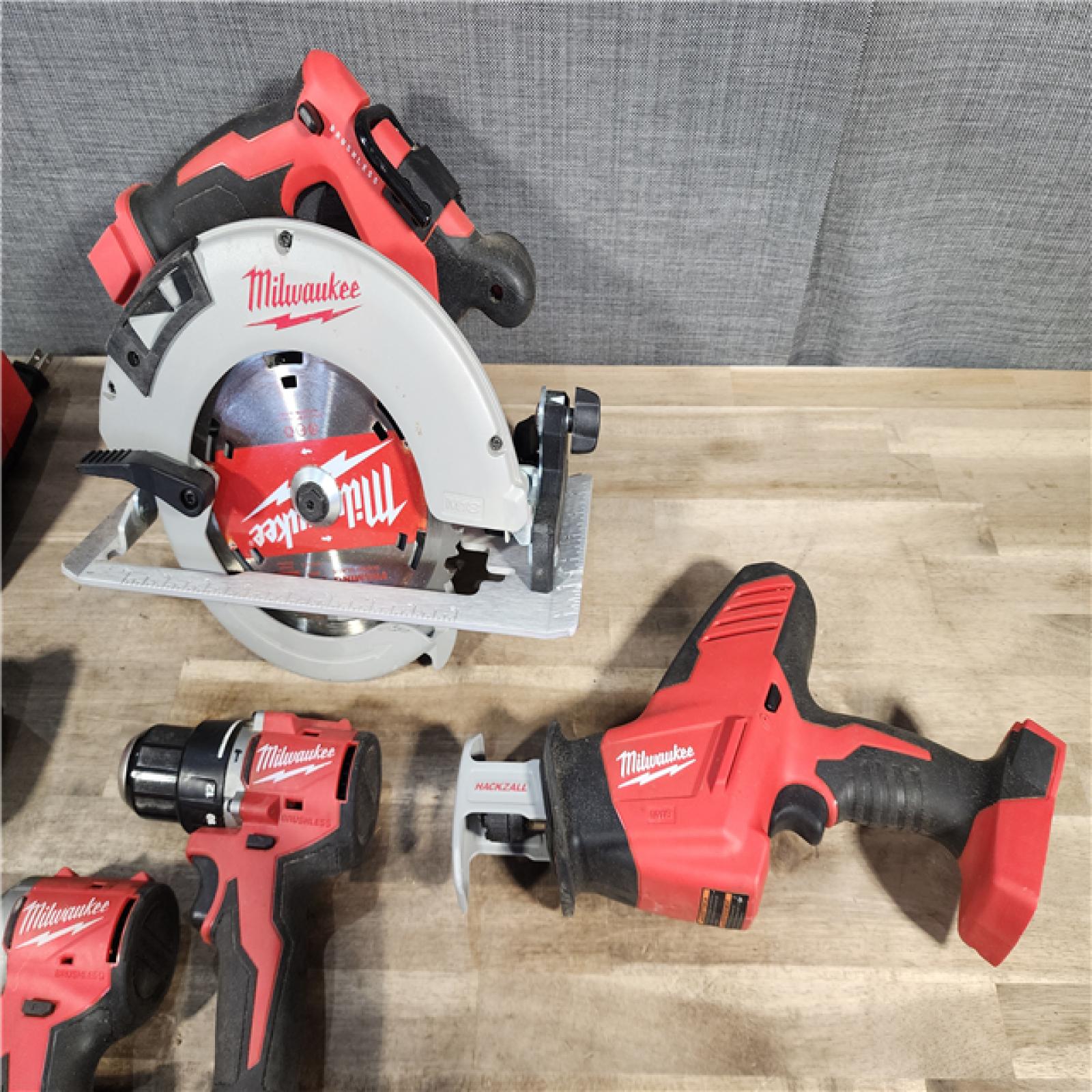 HOUSTON LOCATION - AS-IS Milwaukee M18 18-Volt Lithium-Ion Brushless Cordless Combo Kit (4-Tool) with 2-Batteries, 1-Charger and Tool Bag