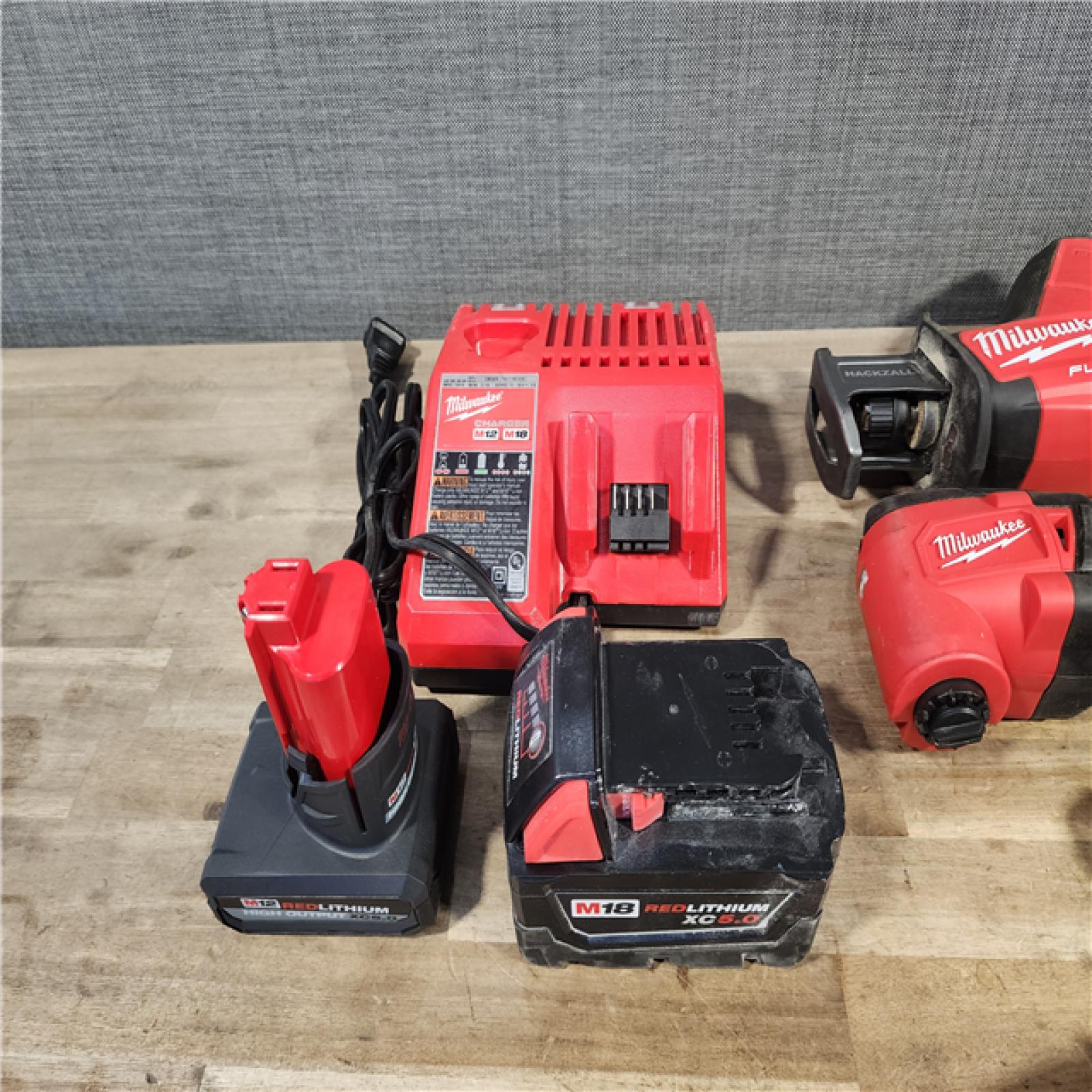 HOUSTON LOCATION - AS-IS MILWAUKEE 5 TOOL COMBO KIT W/ (2) BATTERY & CHARGER
