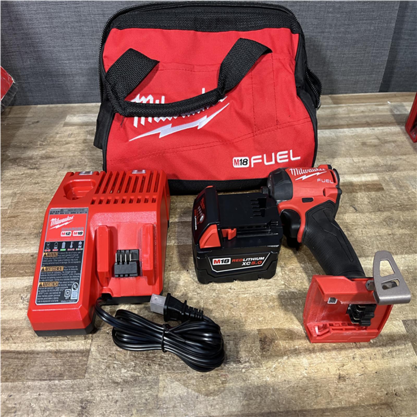 Houston Location AS-IS Milwaukee FUEL SURGE 18V Lithium-Ion Brushless Cordless 1/4 in. Hex Impact Driver Kit and Battery with Charger