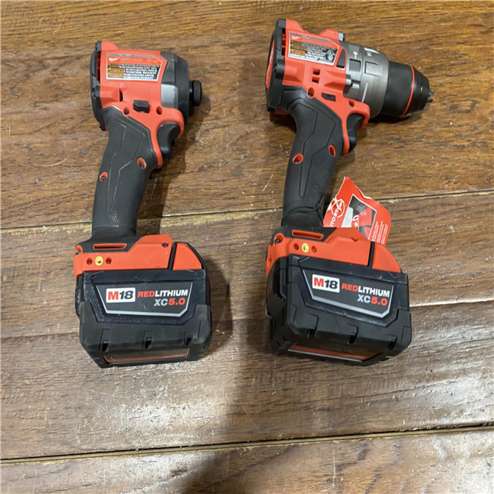 AS-IS MILWAUKEE M18 FUEL 18V Lithium-Ion Brushless Cordless Hammer Drill and Impact Driver Combo Kit (2-Tool) with 2 Batteries