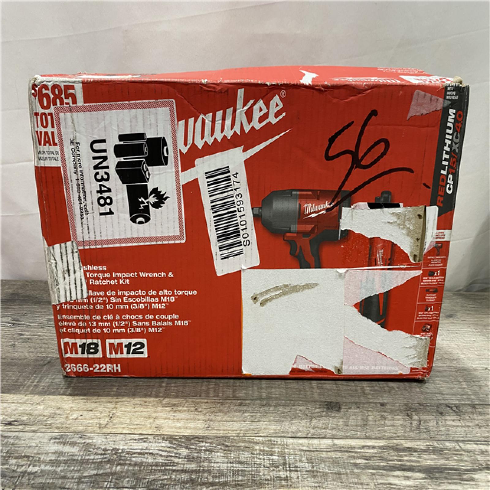 NEW - Milwaukee 12/18V Lithium-Ion Cordless 3/8 in. Ratchet and 1/2 in. High Torque Impact Wrench with Friction Ring Combo Kit