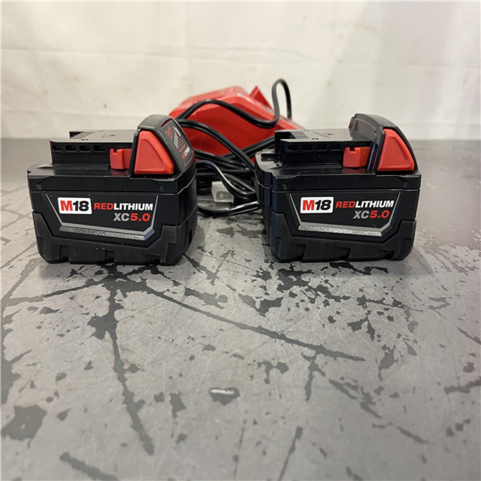 AS-IS- Milwaukee M18 18-Volt Lithium-Ion XC Starter Kit with Two 5.0Ah Batteries and Charger