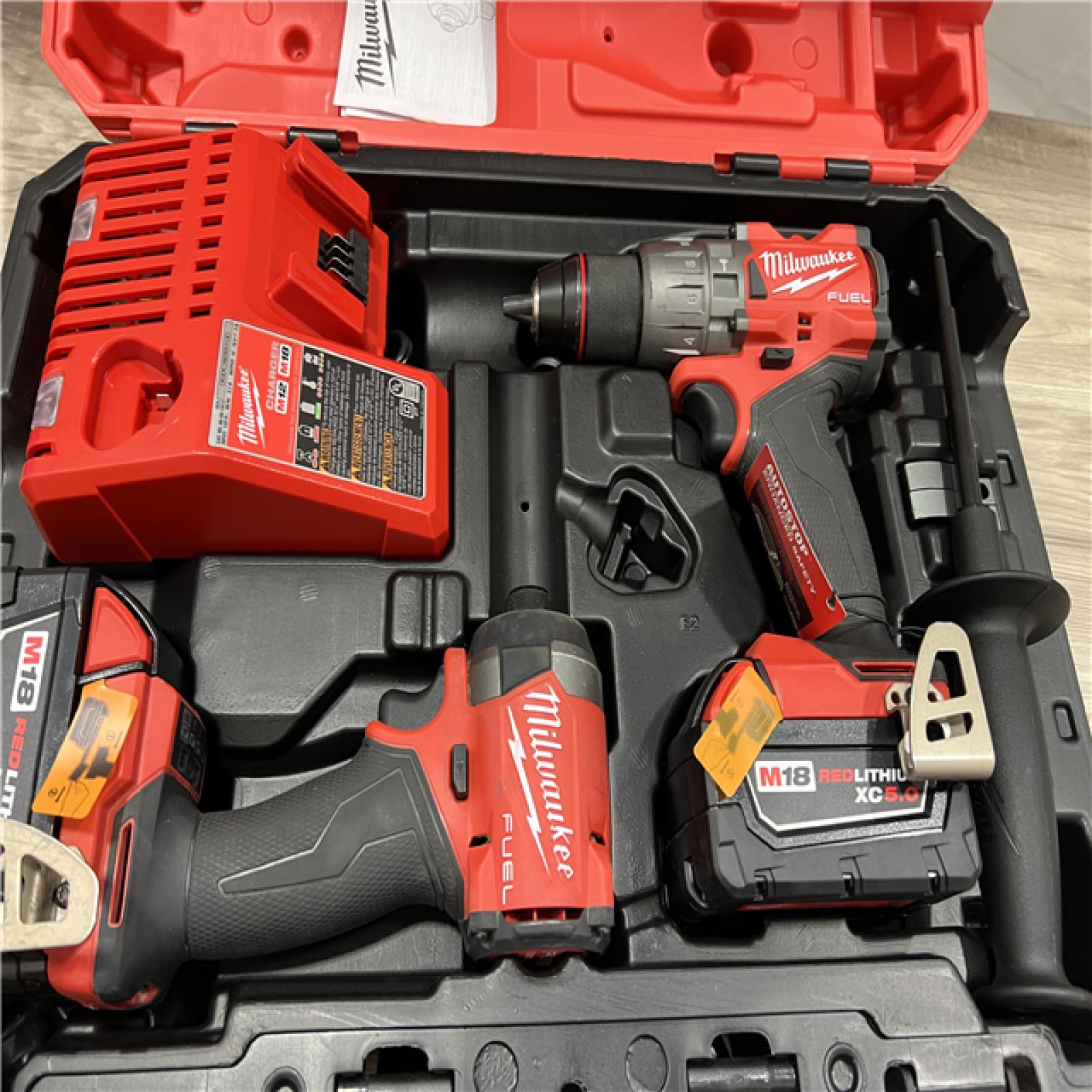 AS-IS Milwaukee FUEL 18V Lithium-Ion Brushless Cordless Hammer Drill and Impact Driver Combo Kit