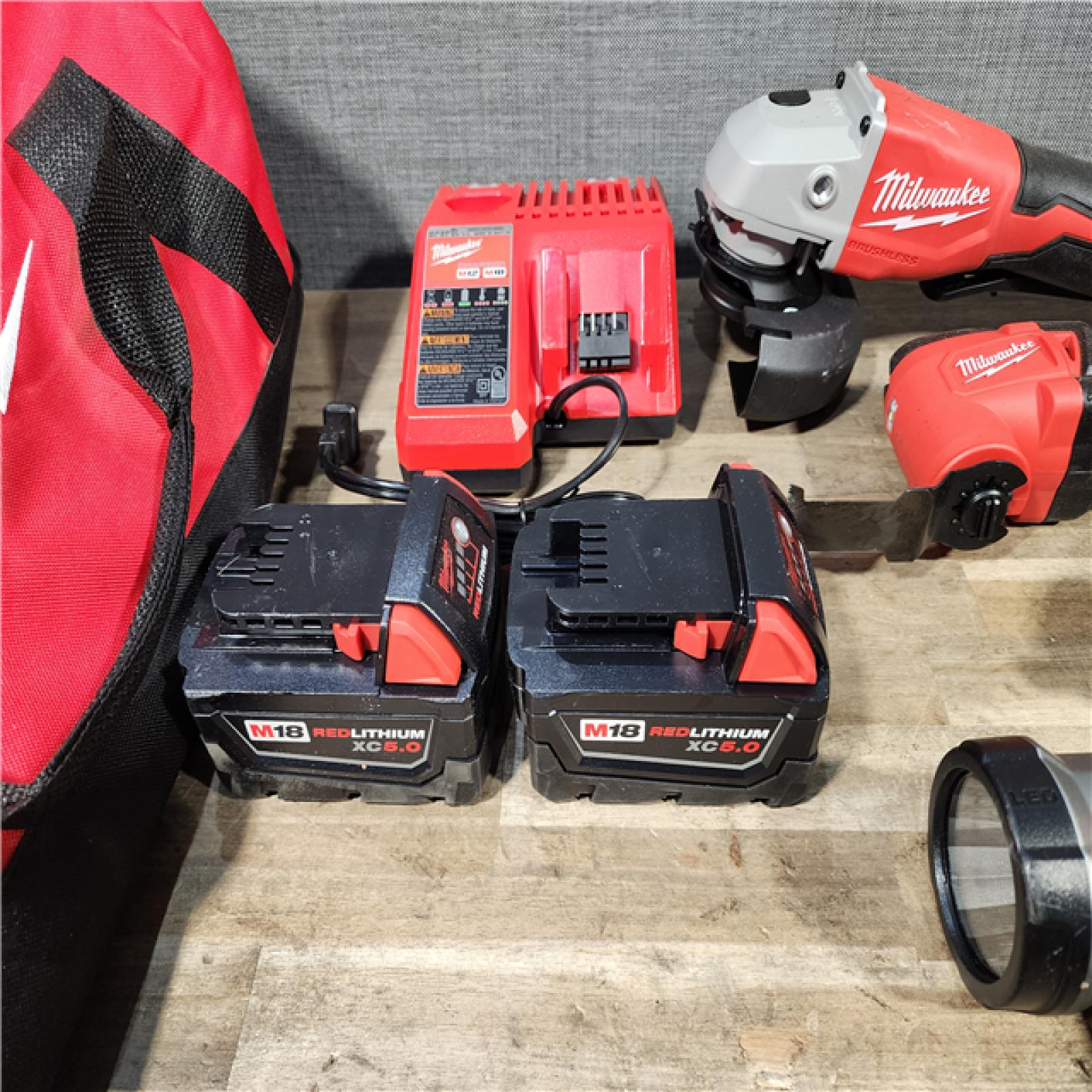 HOUSTON LOCATION - AS-IS MILWAUKEE 7 TOOL COMBO KIT W/ (2) BATTERY & CHARGER