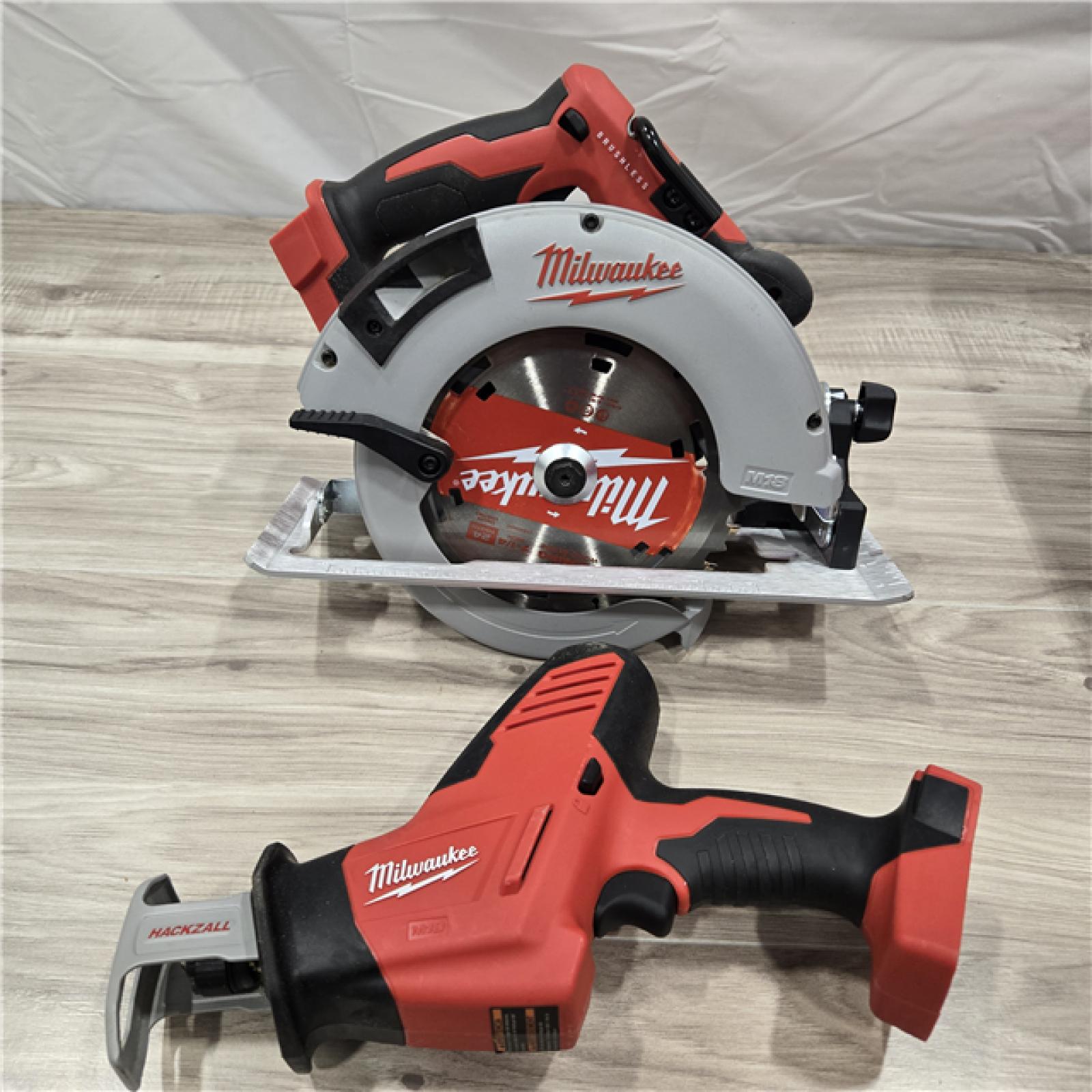 AS-IS Milwaukee M18 18-Volt Lithium-Ion Brushless Cordless Combo Kit (4-Tool) with 2-Batteries, 1-Charger and Tool Bag