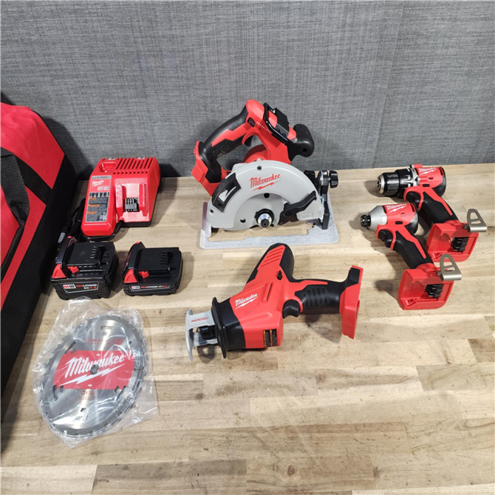 HOUSTON LOCATION - AS-IS (APPEARS LIKE NEW) Milwaukee M18 18-Volt Lithium-Ion Brushless Cordless Combo Kit (4-Tool) with 2-Batteries, 1-Charger and Tool Bag