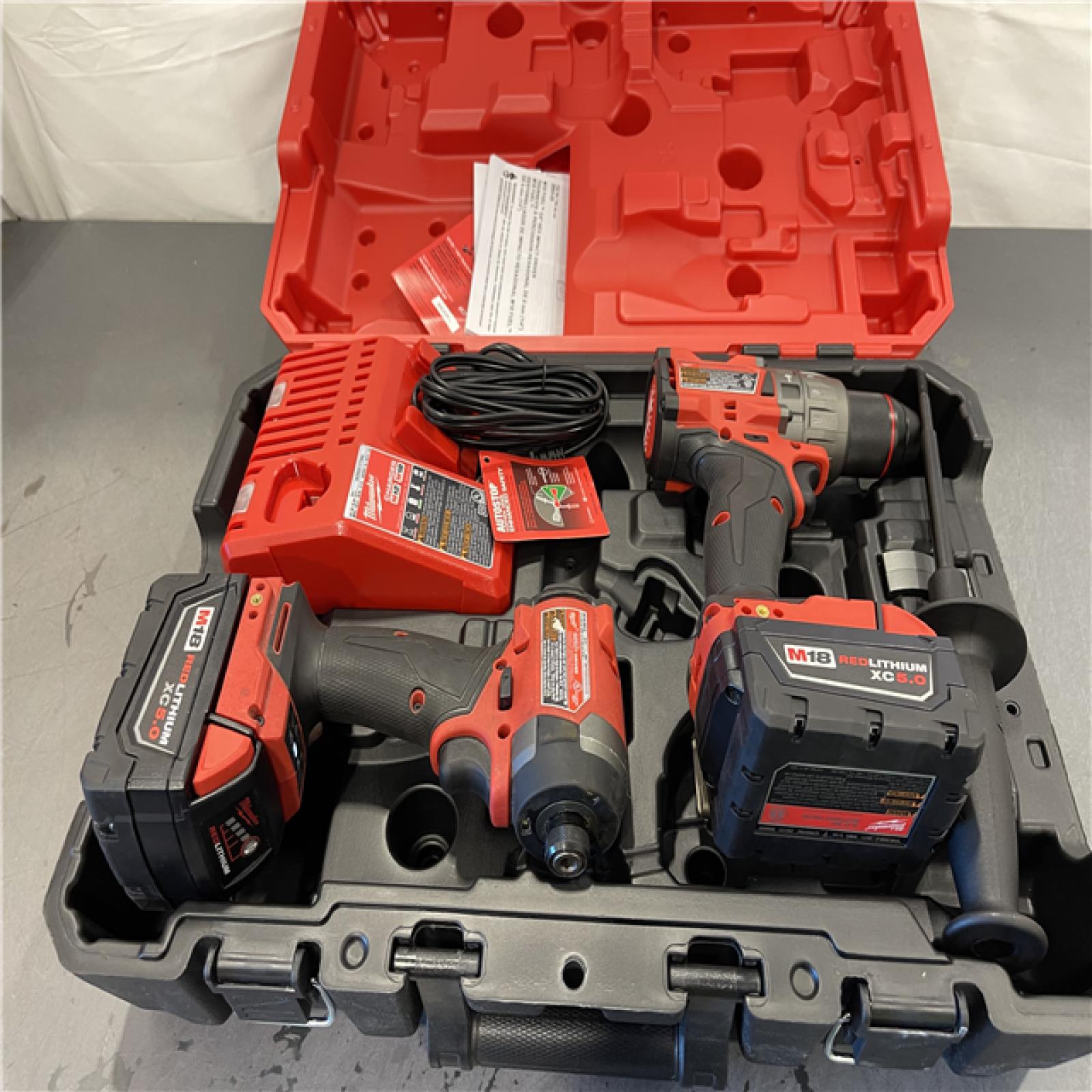 AS-IS - MILWAUKEE FUEL 18V Lithium-Ion Brushless Cordless Hammer Drill and Impact Driver Combo Kit