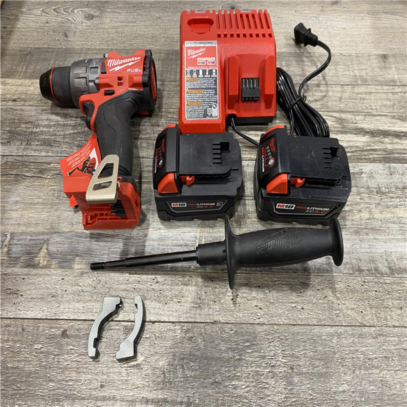 AS-IS Milwaukee FUEL 18V Lithium-Ion Brushless Cordless 1/2 in. Hammer Drill Driver Kit