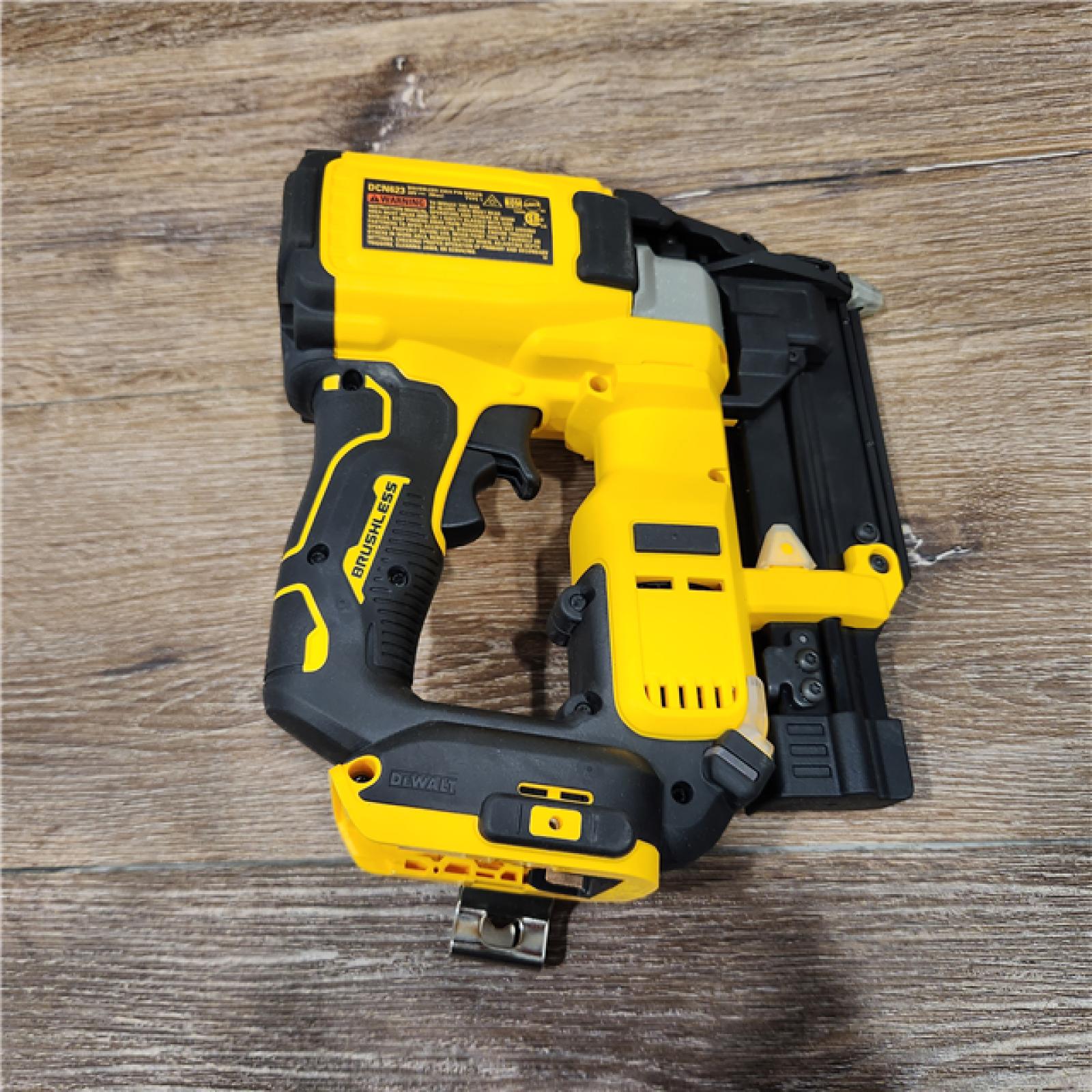 AS-IS DEWALT ATOMIC 20V MAX Lithium Ion Cordless 23 Gauge Pin Nailer Kit with 2.0Ah Battery and Charger (DCN623D1)