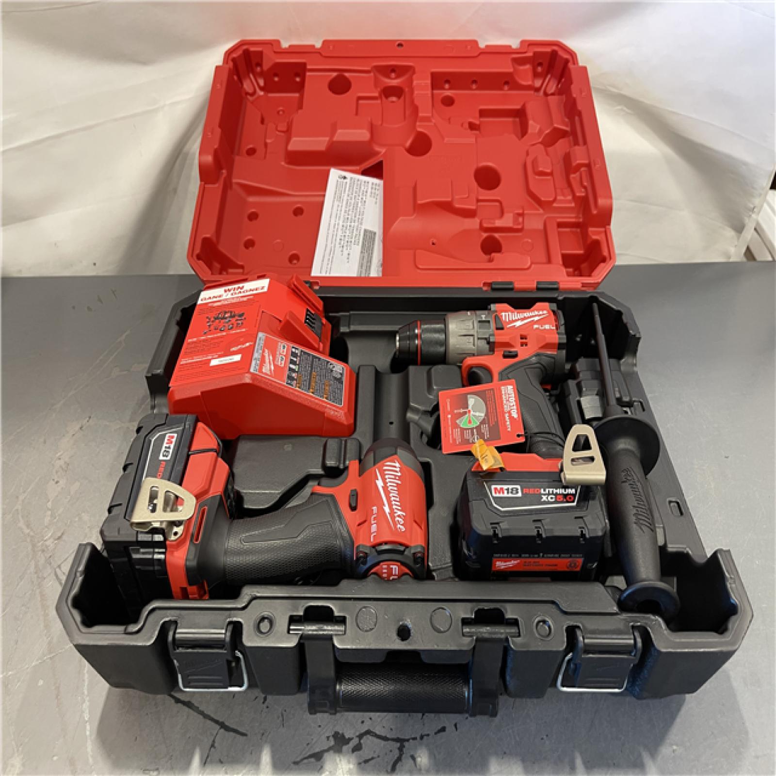AS-IS - Milwaukee M18 FUEL 18V Lithium-Ion Brushless Cordless Hammer Drill and Impact Driver Combo Kit