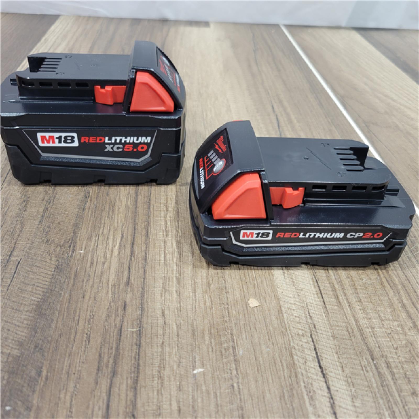 AS-IS  Milwaukee M18 18-Volt Lithium-Ion Starter Kit with One 5.0 Ah and One 2.0 Ah Battery and Charger