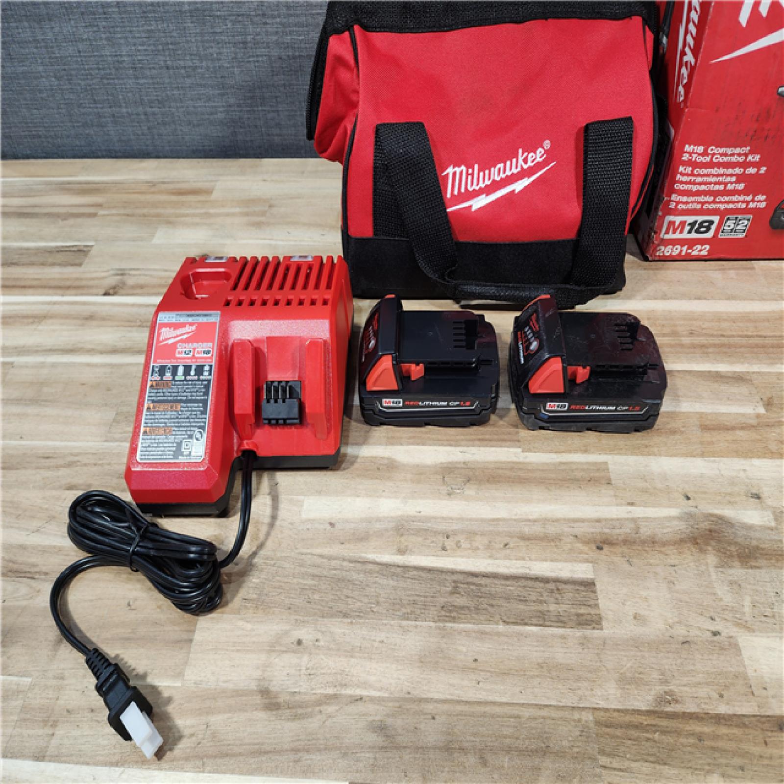 HOUSTON LOCATION - AS-IS Milwaukee  18V Lithium-Ion Cordless Drill Driver/Impact Driver Combo Kit