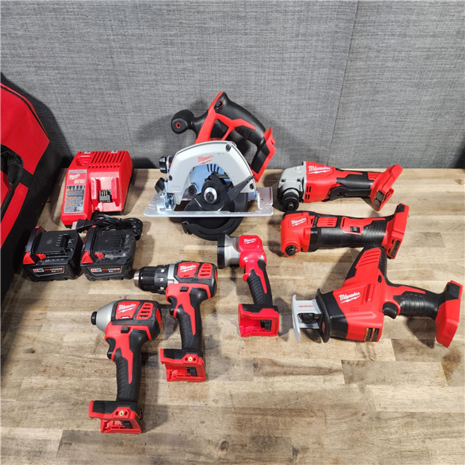 HOUSTON LOCATION - AS-IS Milwaukee M18 18-Volt Lithium-Ion Cordless Combo Kit 7-Tool with 2-Batteries, Charger and Tool Bag