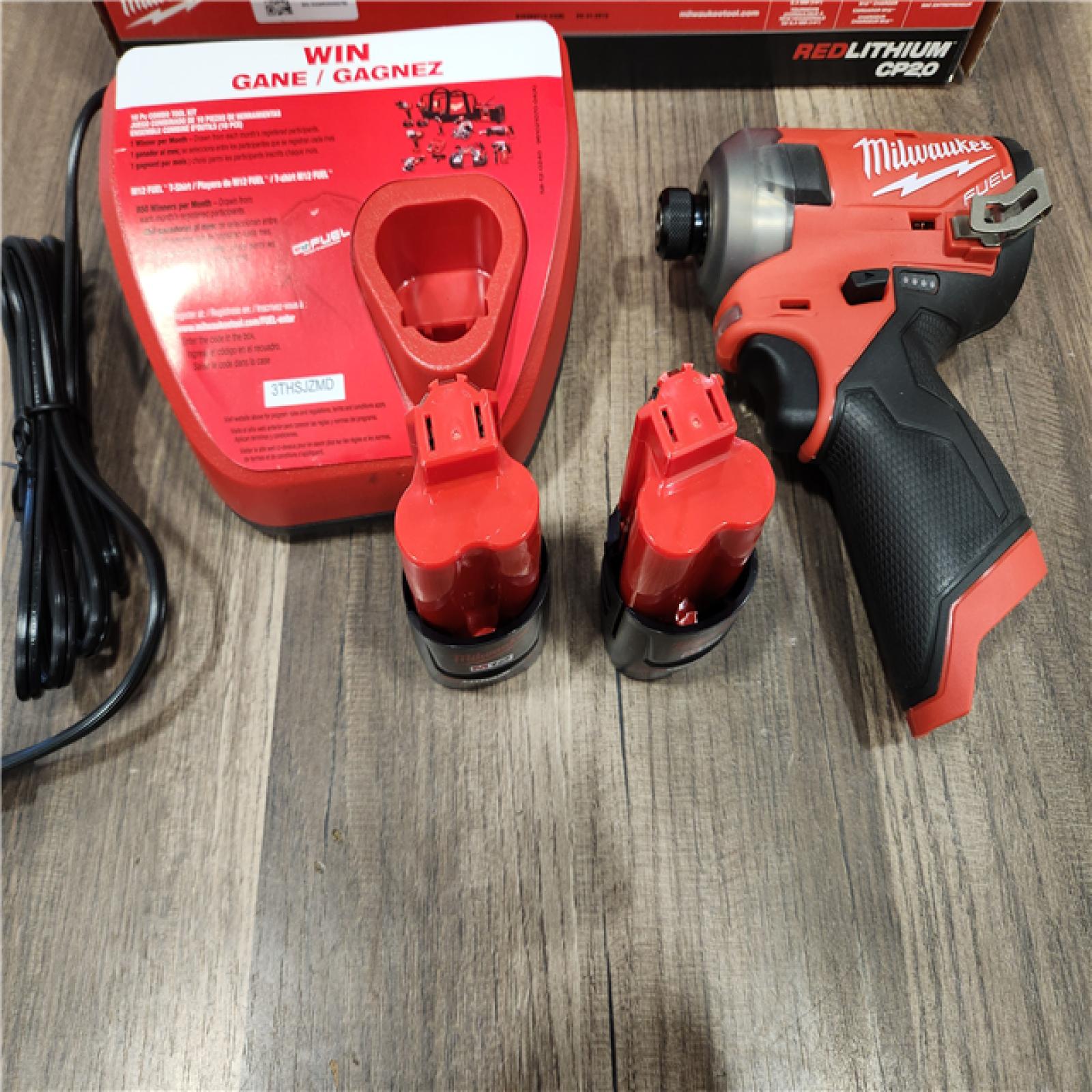 AS-IS Milwaukee M12 FUEL SURGE 12V Lithium-Ion Brushless Cordless 1/4 in. Hex Impact Driver Compact Kit W/Two 2.0Ah Batteries, Bag