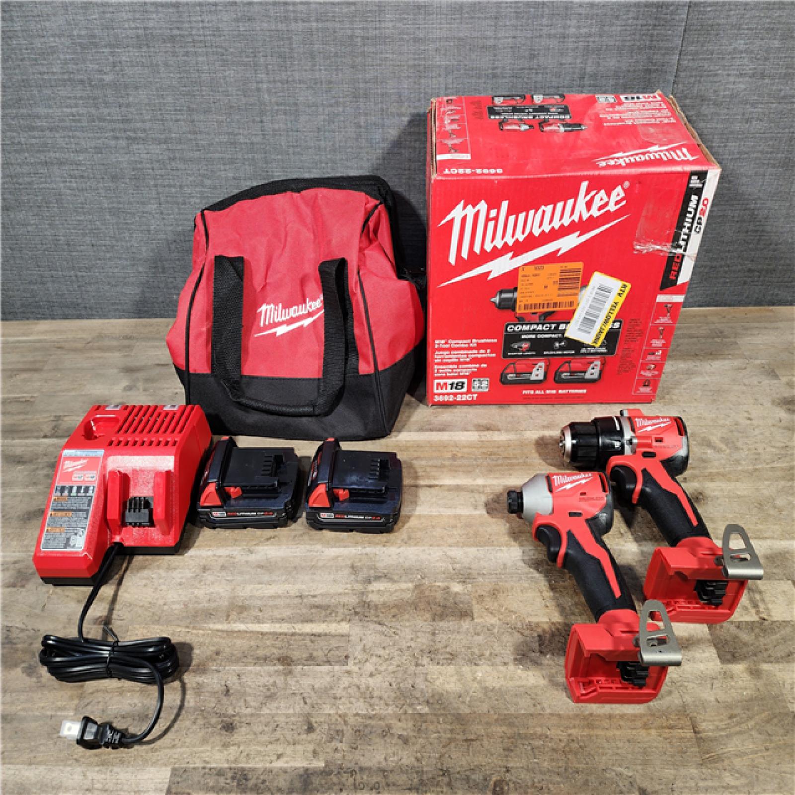 HOUSTON LOCATION - AS-IS Milwaukee M18 18V Lithium-Ion Brushless Cordless Compact Drill/Impact Combo Kit (2-Tool) W/(2) 2.0 Ah Batteries  Charger & Bag