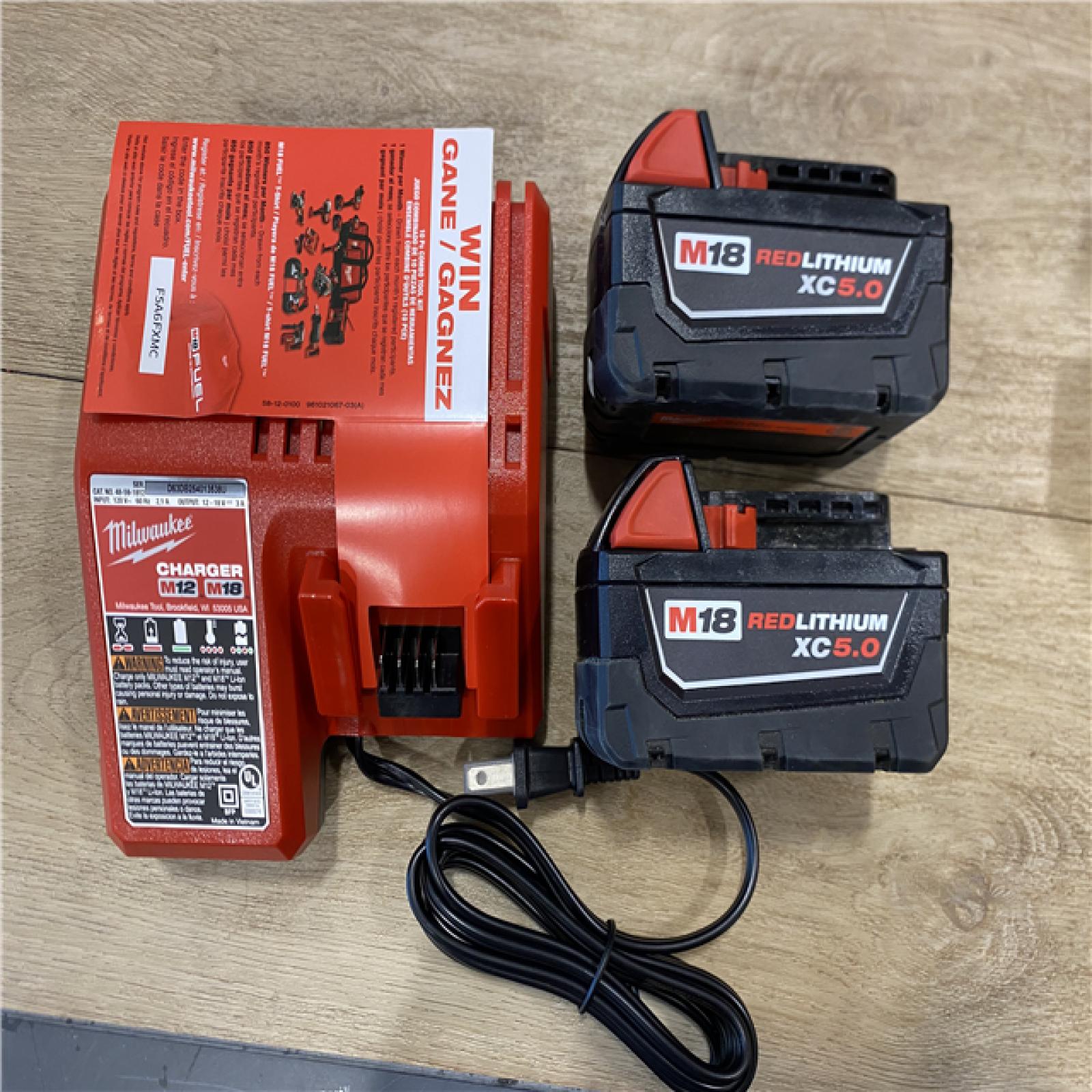 AS-IS Milwaukee FUEL 18V Lithium-Ion Brushless Cordless Hammer Drill and Impact Driver Combo Kit