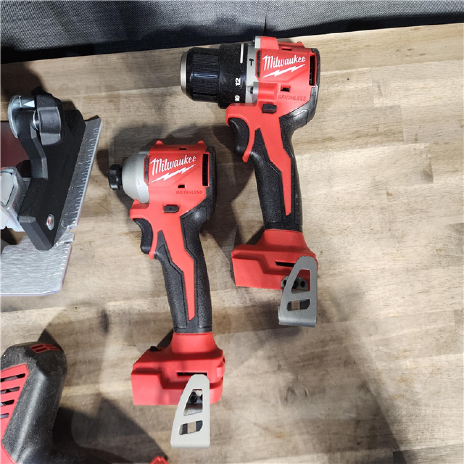HOUSTON LOCATION - AS-IS Milwaukee M18 18-Volt Lithium-Ion Brushless Cordless Combo Kit (4-Tool) with 2-Batteries, 1-Charger