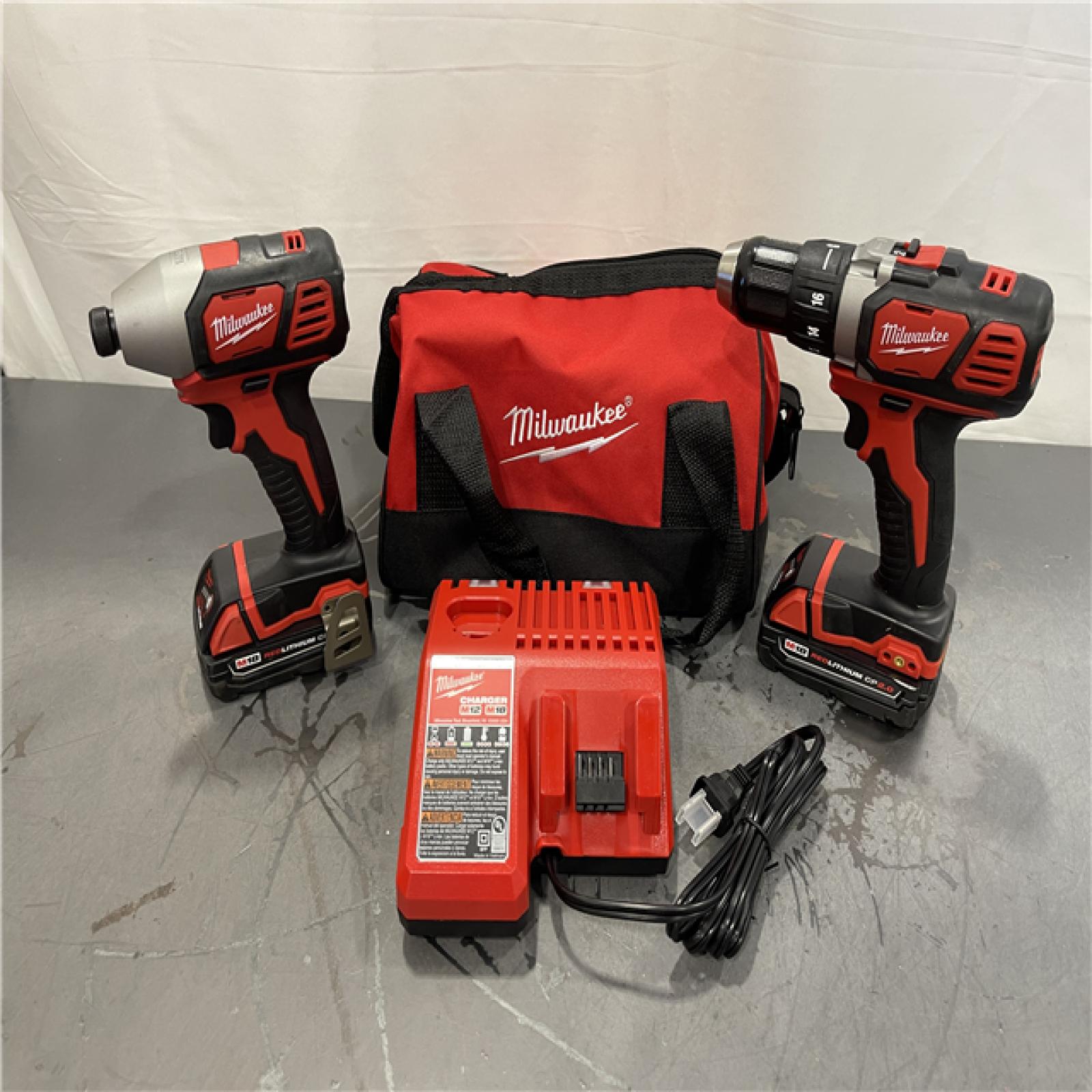 AS-IS - Milwaukee M18 18V Lithium-Ion Cordless Drill Driver/Impact Driver Combo Kit