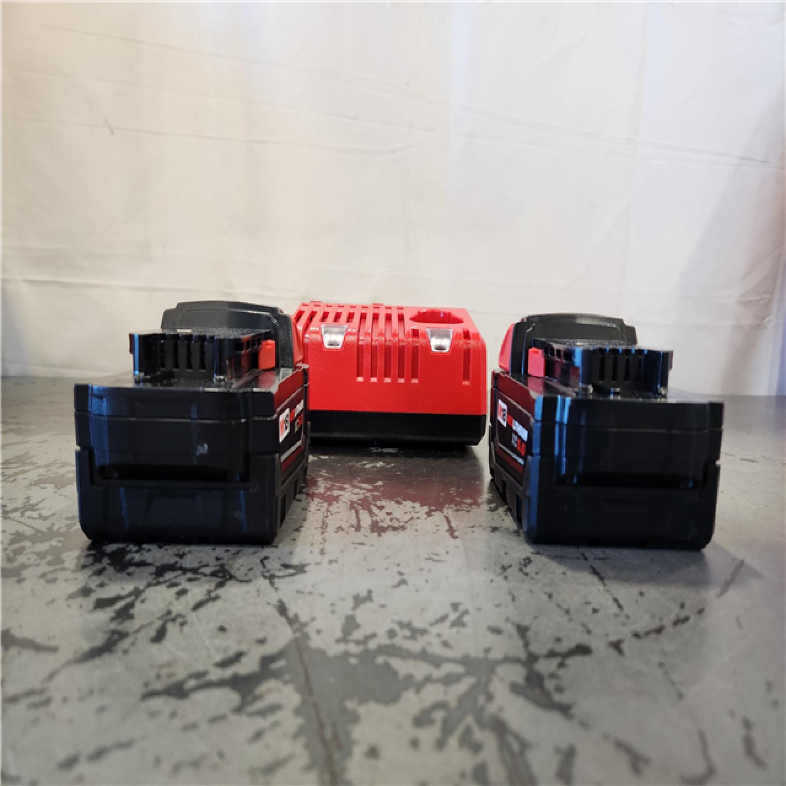 AS-IS- Milwaukee 18-Volt Lithium-Ion XC Starter Kit with Two 5.0Ah Batteries and Charger