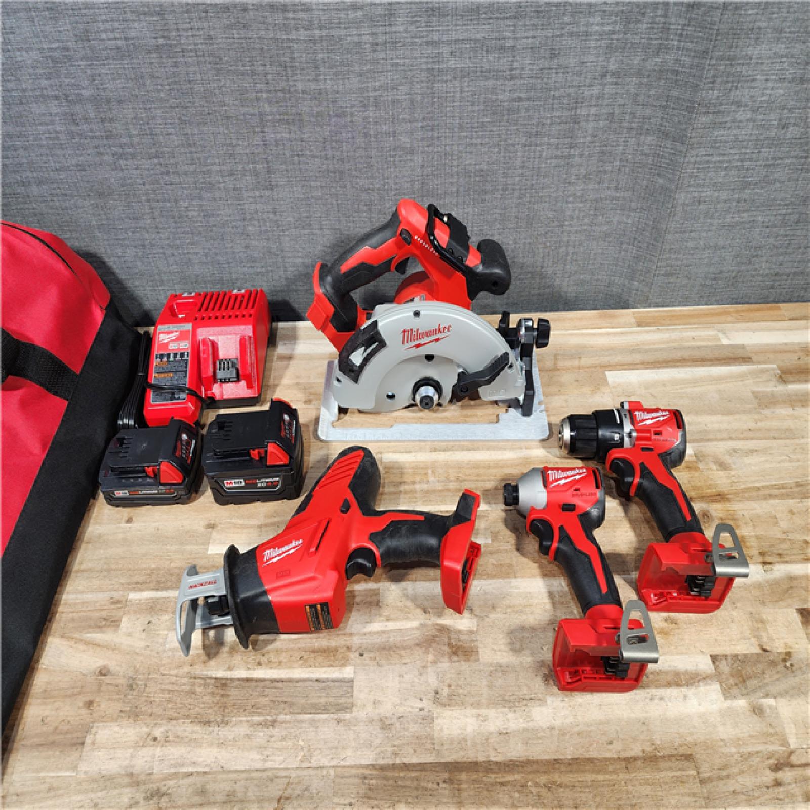HOUSTON LOCATION - AS-IS MILWAUKEE 4 TOOL COMBO KIT W/ (2) BATTERY & CHARGER
