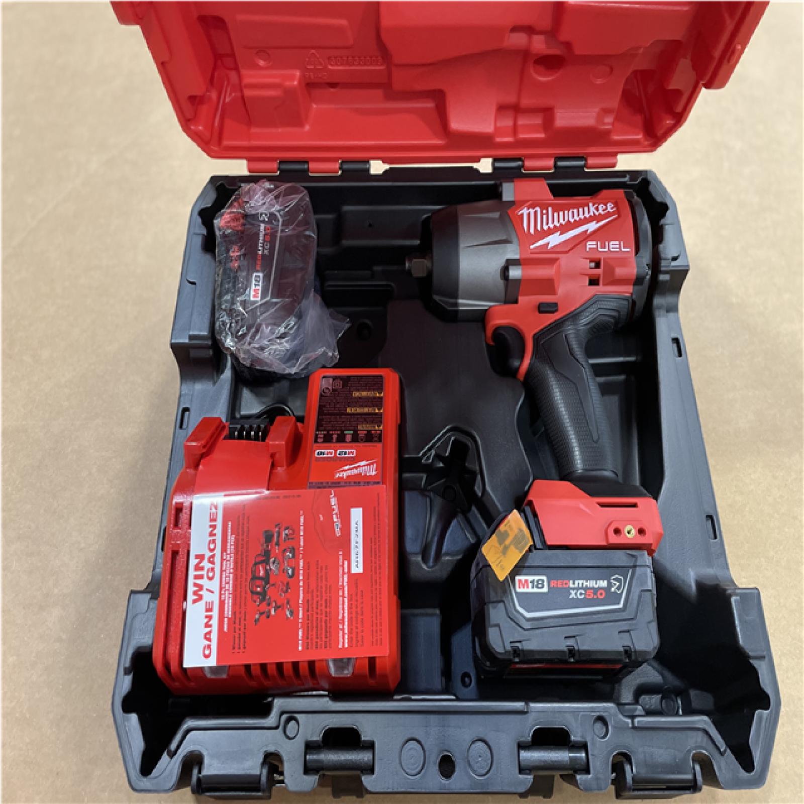DALLAS LOCATION- MILWAUKEE M18 FUEL 18V Lithium-Ion Brushless Cordless High-Torque 1/2 in. Impact Wrench Kit 5.0 Ah.