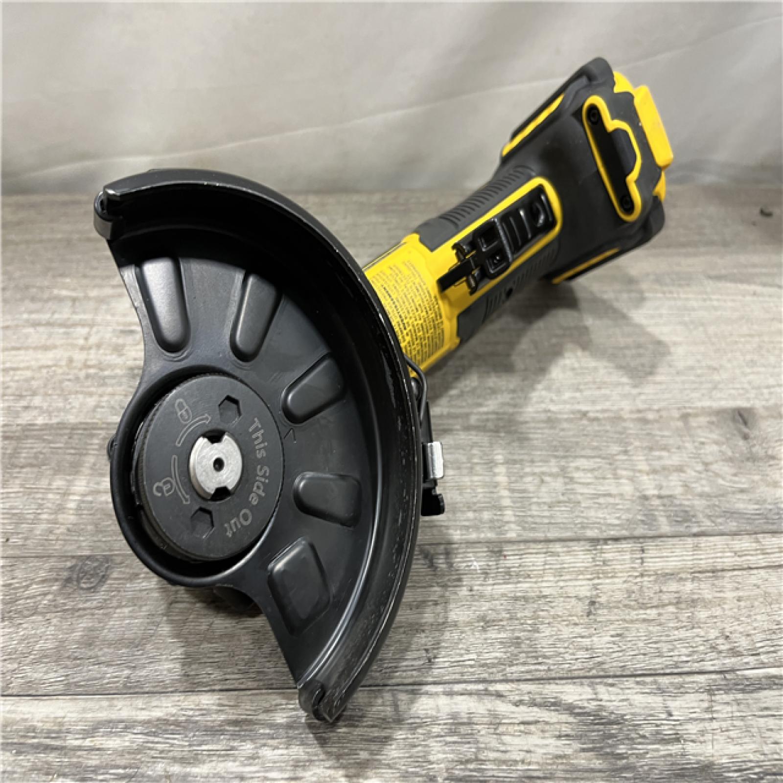 AS-IS DEWALT ATOMIC 20V MAX Cordless 4-1/2 in. Angle Grinder with Paddle Switch (Tool Only)