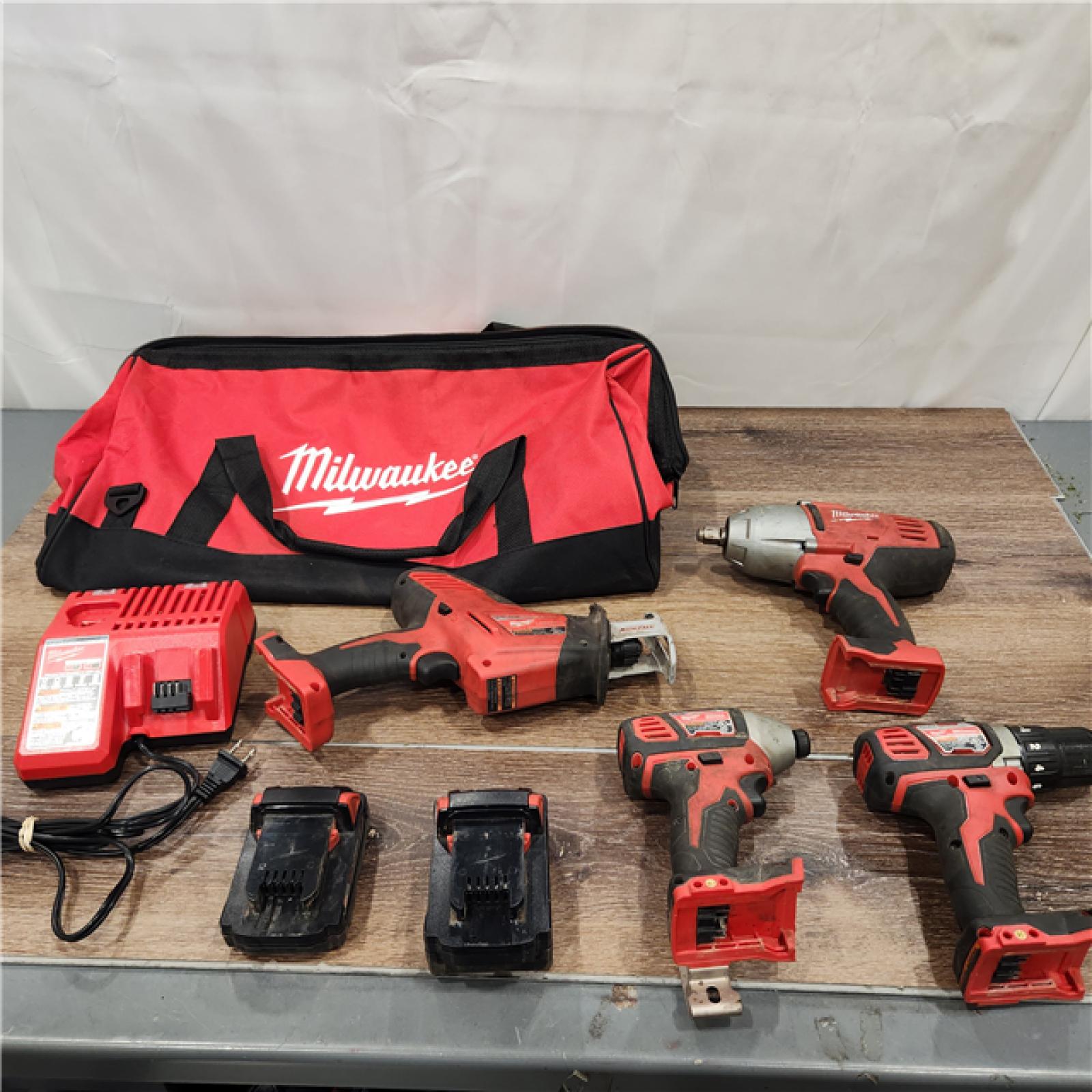 AS-IS Milwaukee M18 18-Volt Lithium-Ion Cordless Combo Kit 4-Tool) with 2-Batteries, Charger and Tool Bag