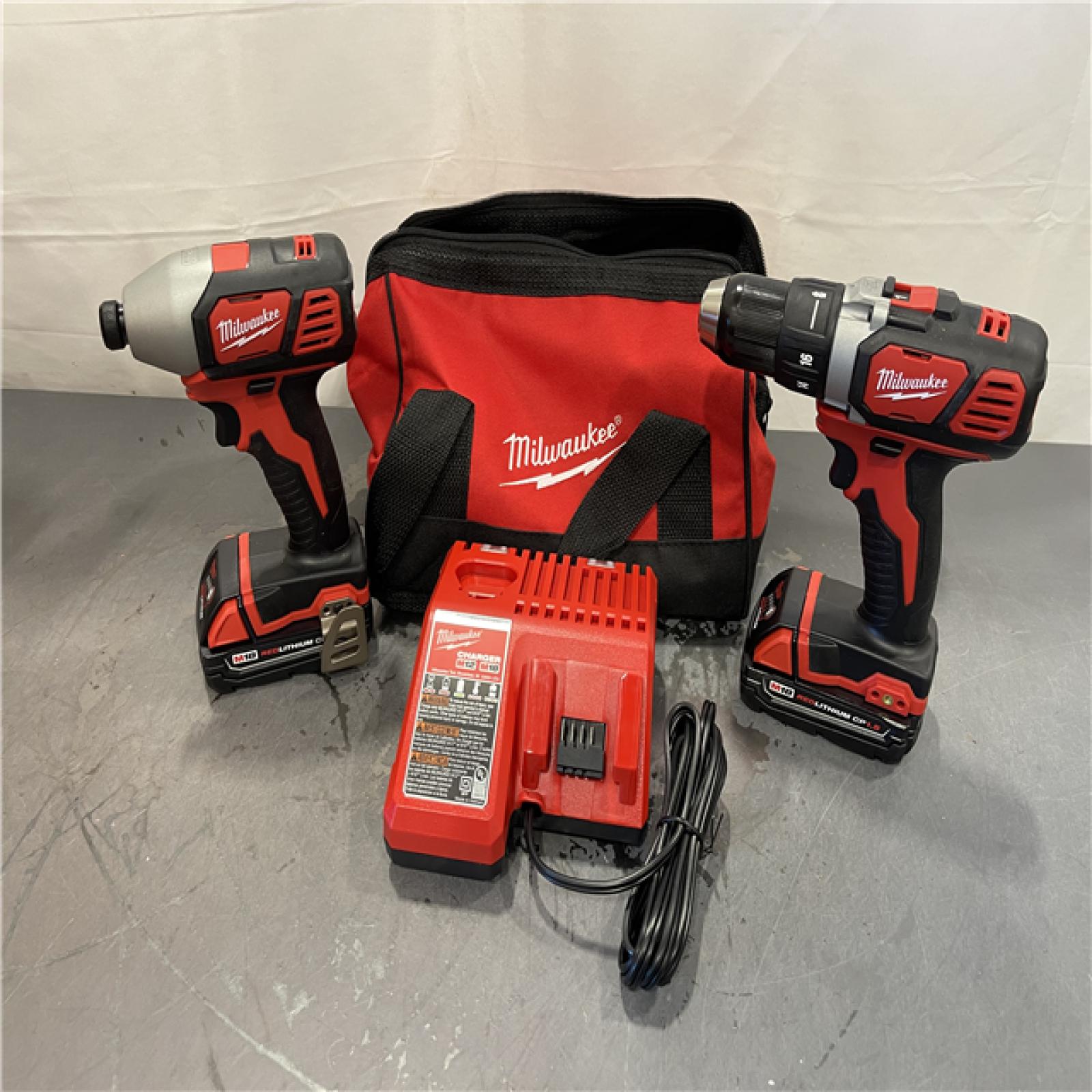 AS-IS - Milwaukee M18 18V Lithium-Ion Cordless Drill Driver/Impact Driver Combo Kit (2-Tool)