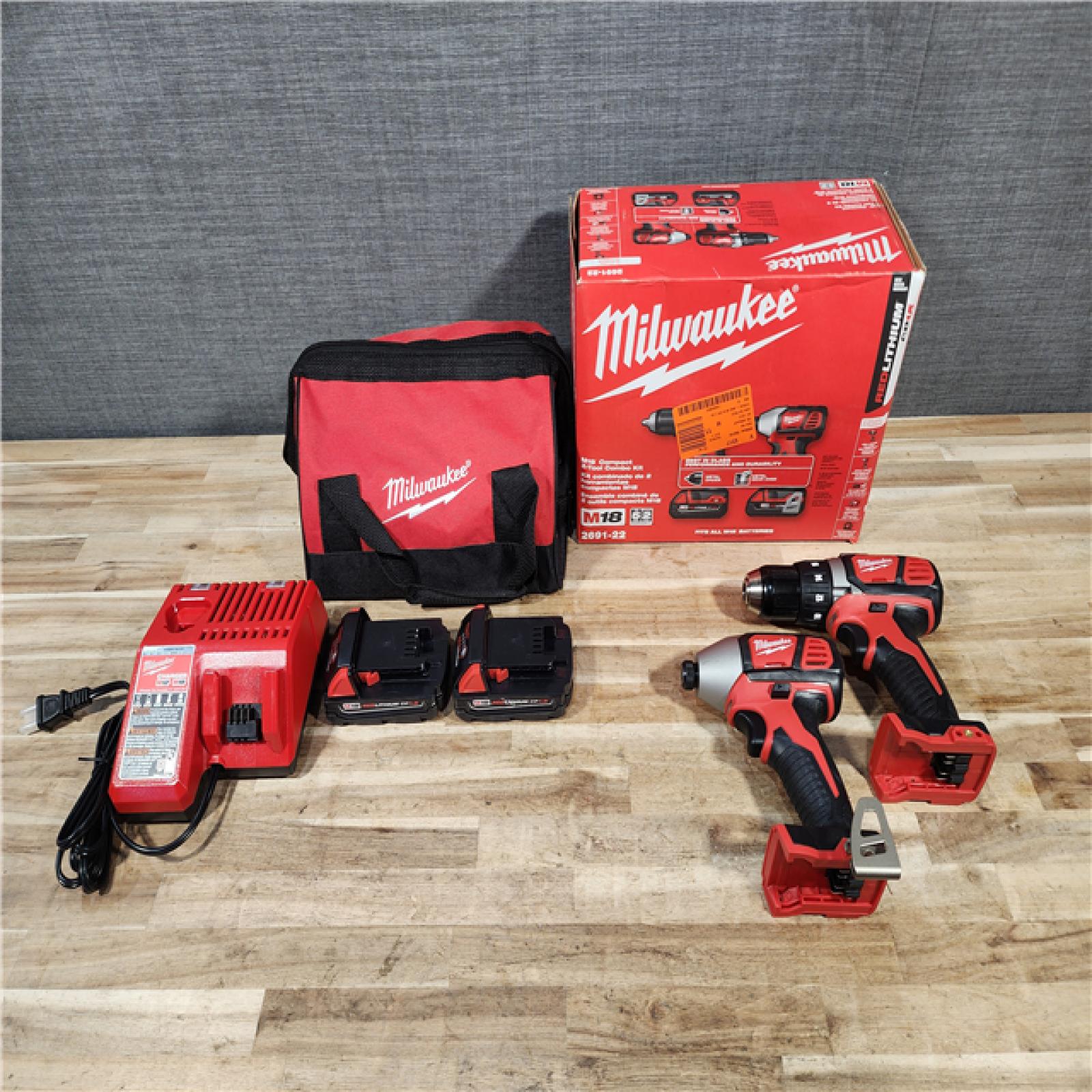 HOUSTON LOCATION - AS-IS Milwaukee M18 18V Lithium-Ion Cordless Drill Driver/Impact Driver Combo Kit