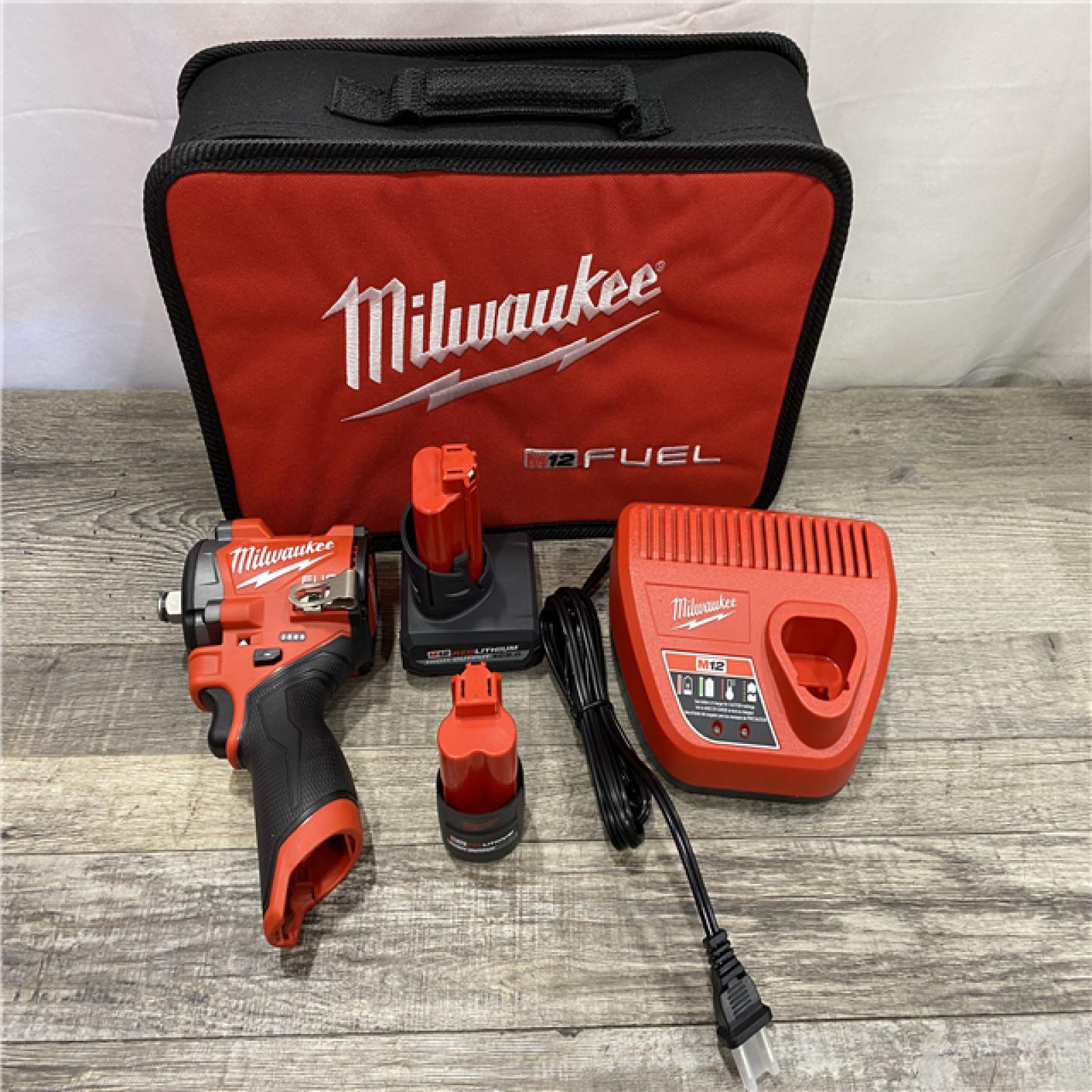 AS-IS Milwaukee FUEL 12V Li-Ion Brushless Cordless Stubby 1/2 in. Impact Wrench Kit
