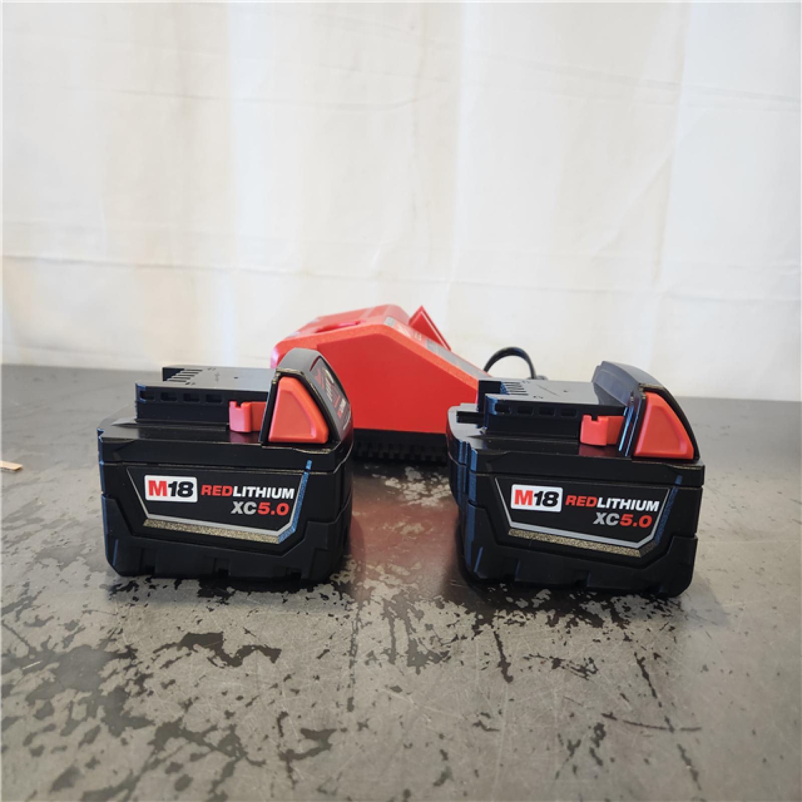 AS-IS- Milwaukee 18-Volt Lithium-Ion XC Starter Kit with Two 5.0Ah Batteries and Charger