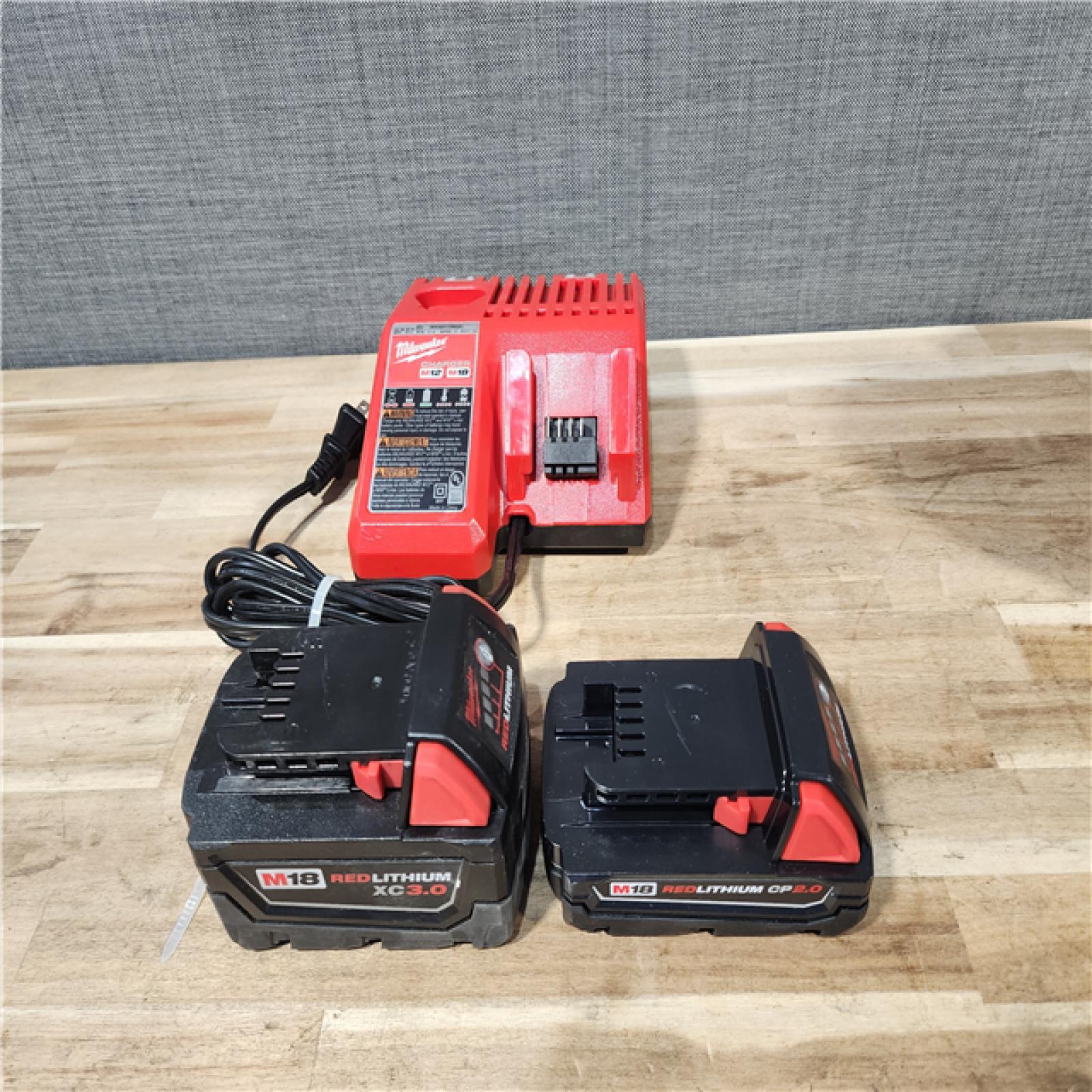 HOUSTON LOCATION - AS-IS MILWAUKEE 2 TOOL COMBO KIT W/ (2) BATTERY & CHARGER