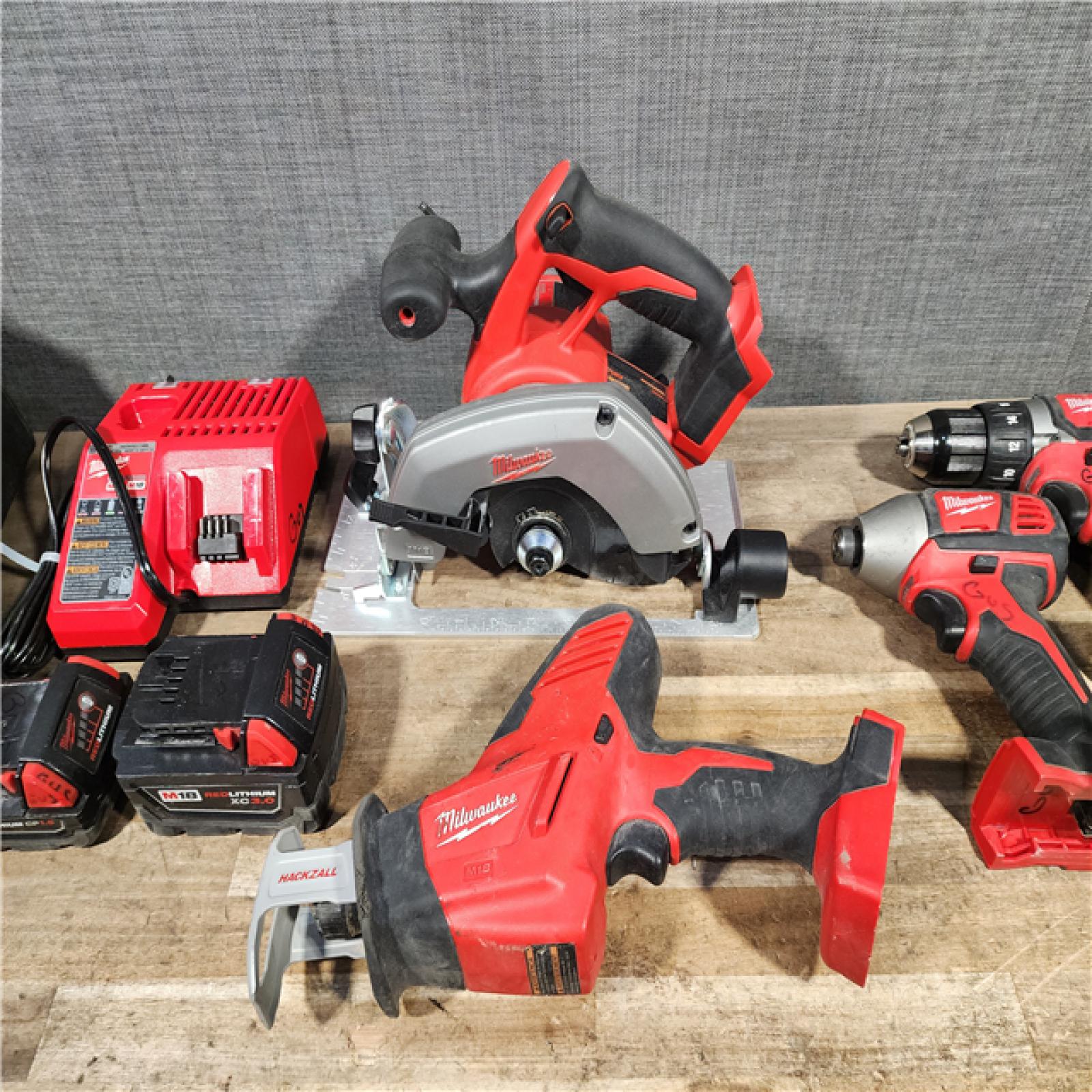 HOUSTON LOCATION - AS-IS MILWAUKEE 5 TOOL COMBO KIT W/ (2) BATTERY & CHARGER