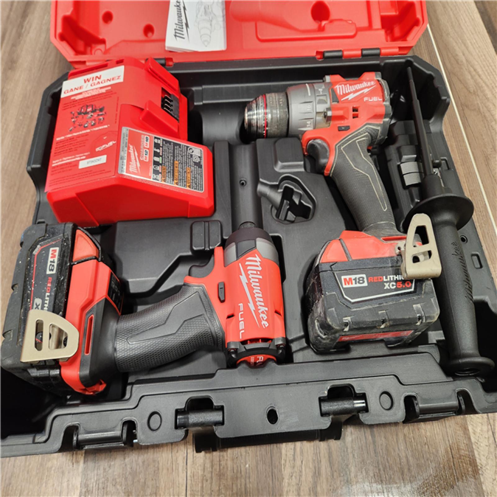 AS-IS  Milwaukee M18 FUEL 18V Lithium-Ion Brushless Cordless Hammer Drill and Impact Driver Combo Kit (2-Tool) with 2 Batteries
