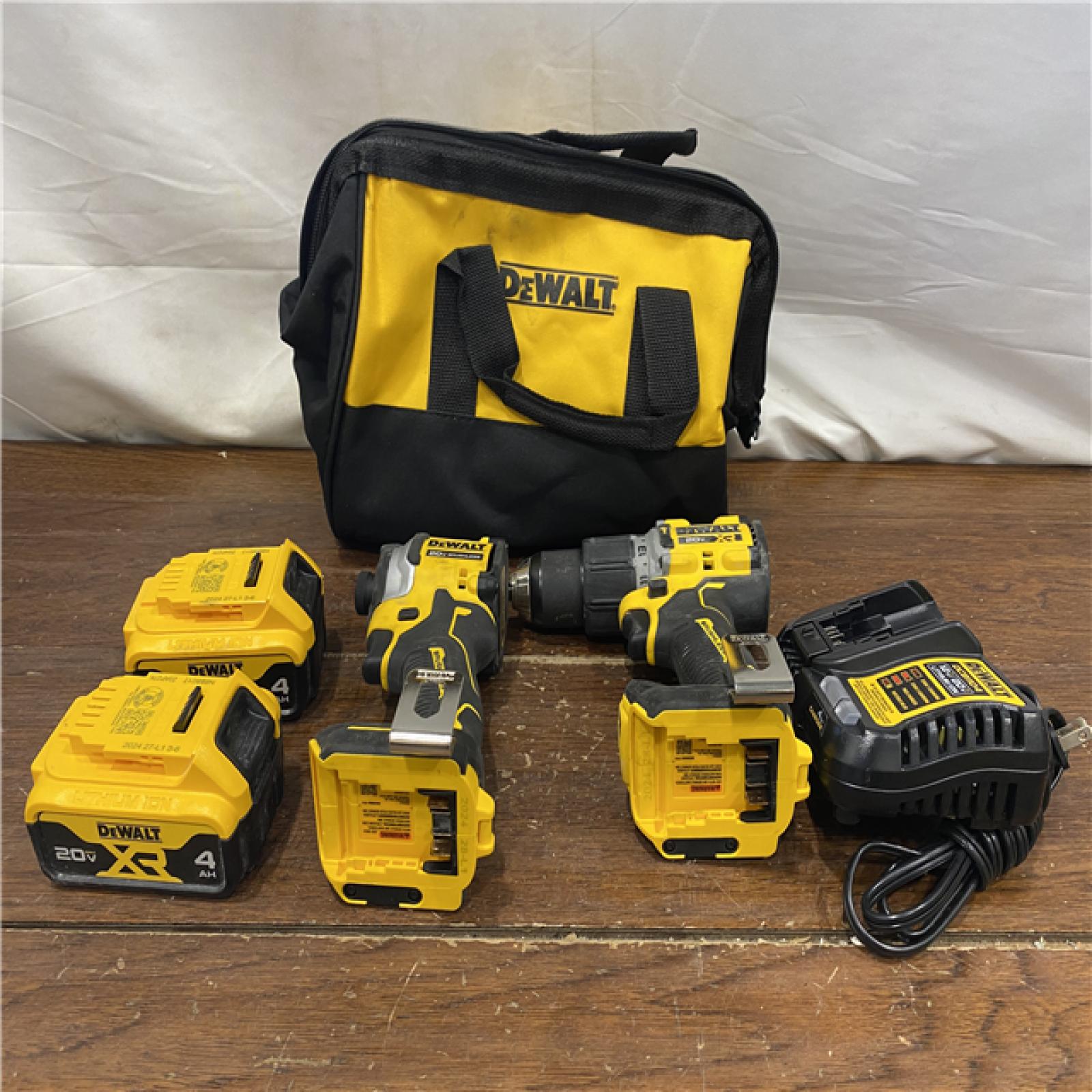 AS-IS DEWALT 20V MAX XR Hammer Drill and ATOMIC Impact Driver 2 Tool Cordless Combo Kit with (2) 4.0Ah Batteries, Charger, and Bag