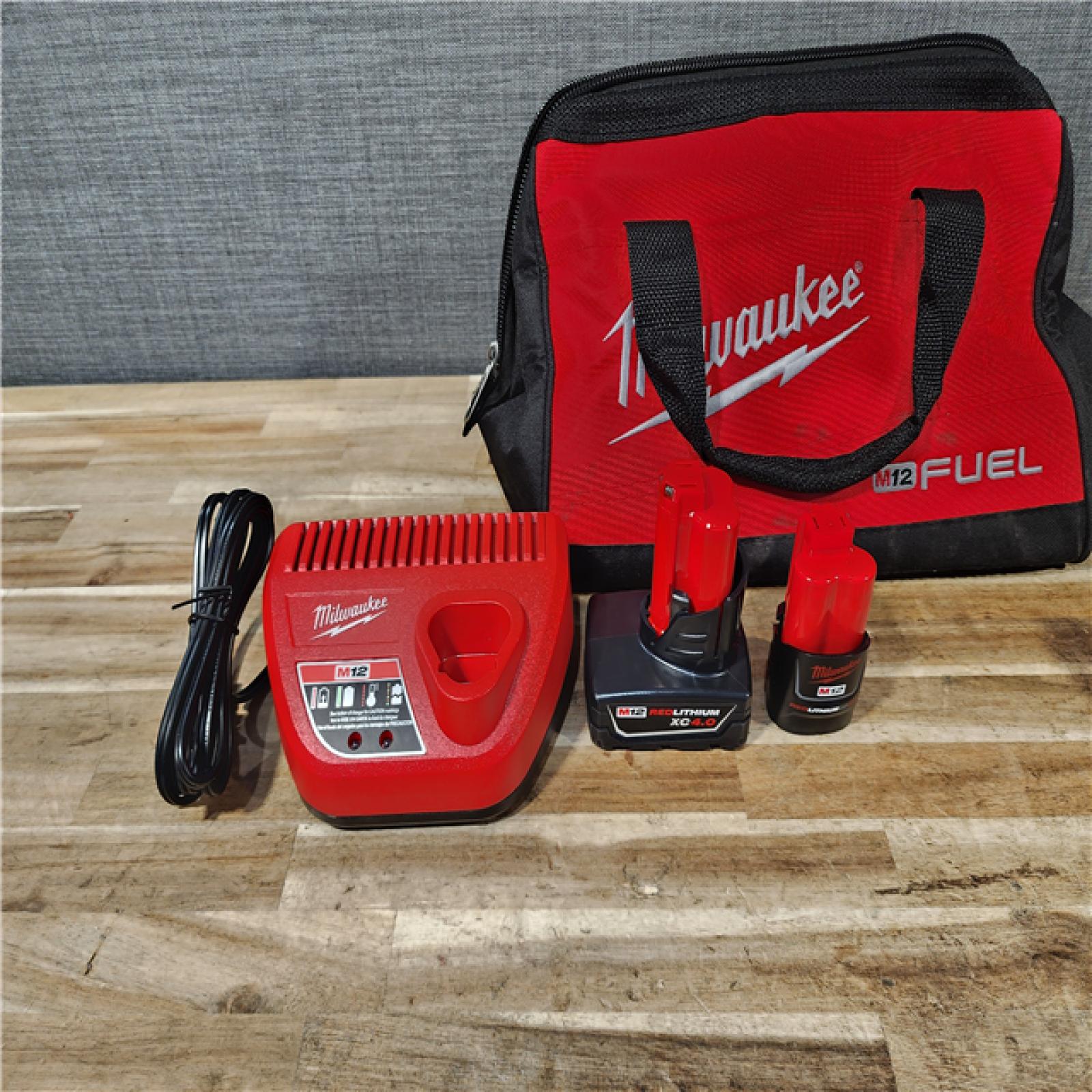 HOUSTON LOCATION - AS-IS Milwaukee FUEL 12-Volt Lithium-Ion Brushless Cordless Hammer Drill and Impact Driver Combo Kit