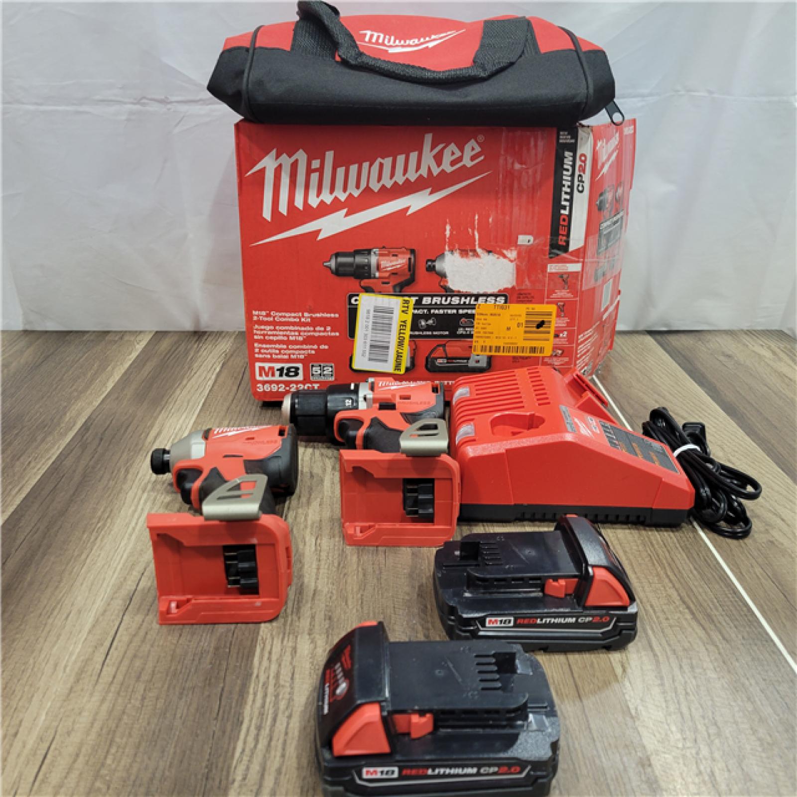 AS-IS Milwaukee M18 18V Lithium-Ion Brushless Cordless Compact Drill/Impact Combo Kit (2-Tool) W/(2) 2.0 Ah Batteries, Charger & Bag