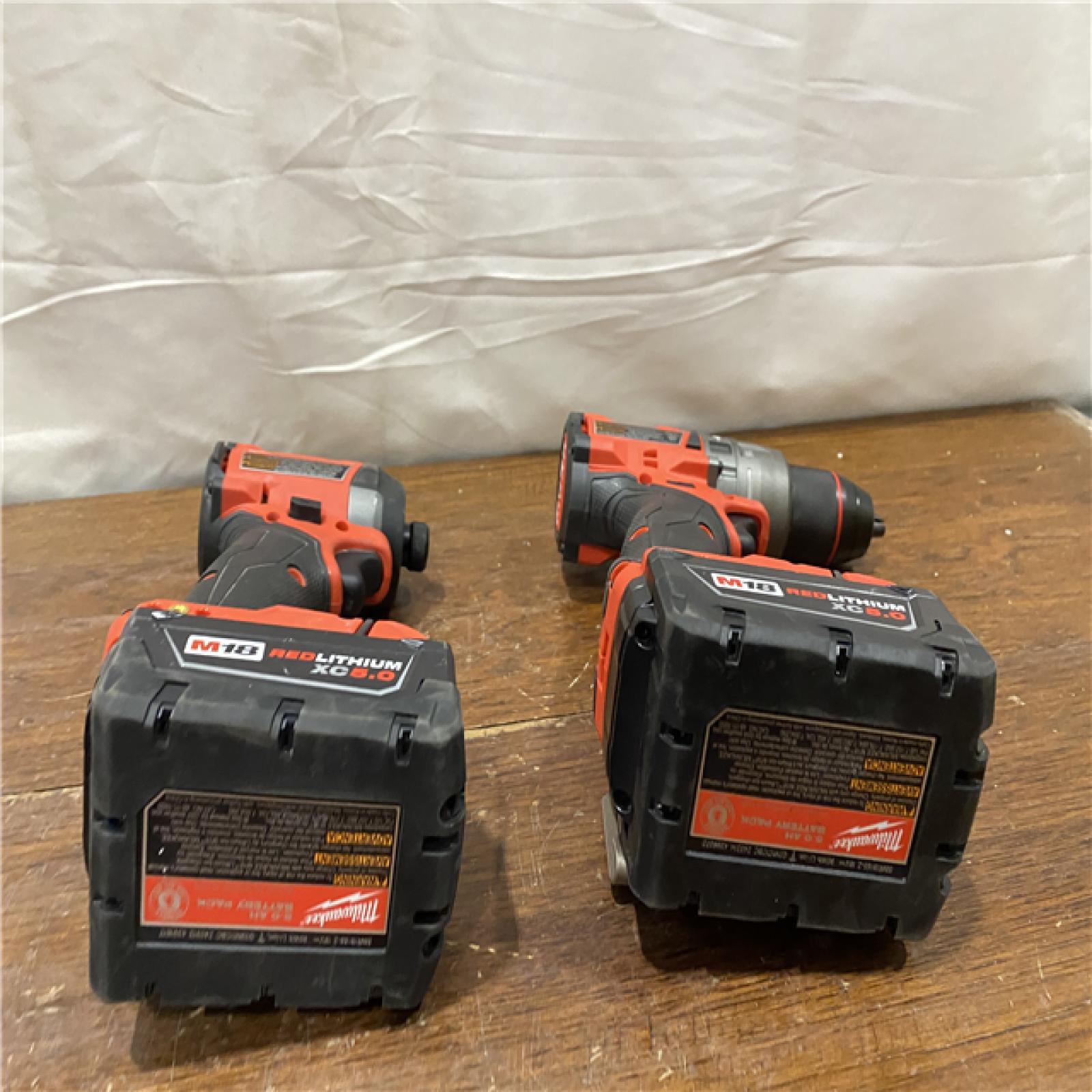 AS-IS MILWAUKEE M18 FUEL 18V Lithium-Ion Brushless Cordless Hammer Drill and Impact Driver Combo Kit (2-Tool) with 2 Batteries