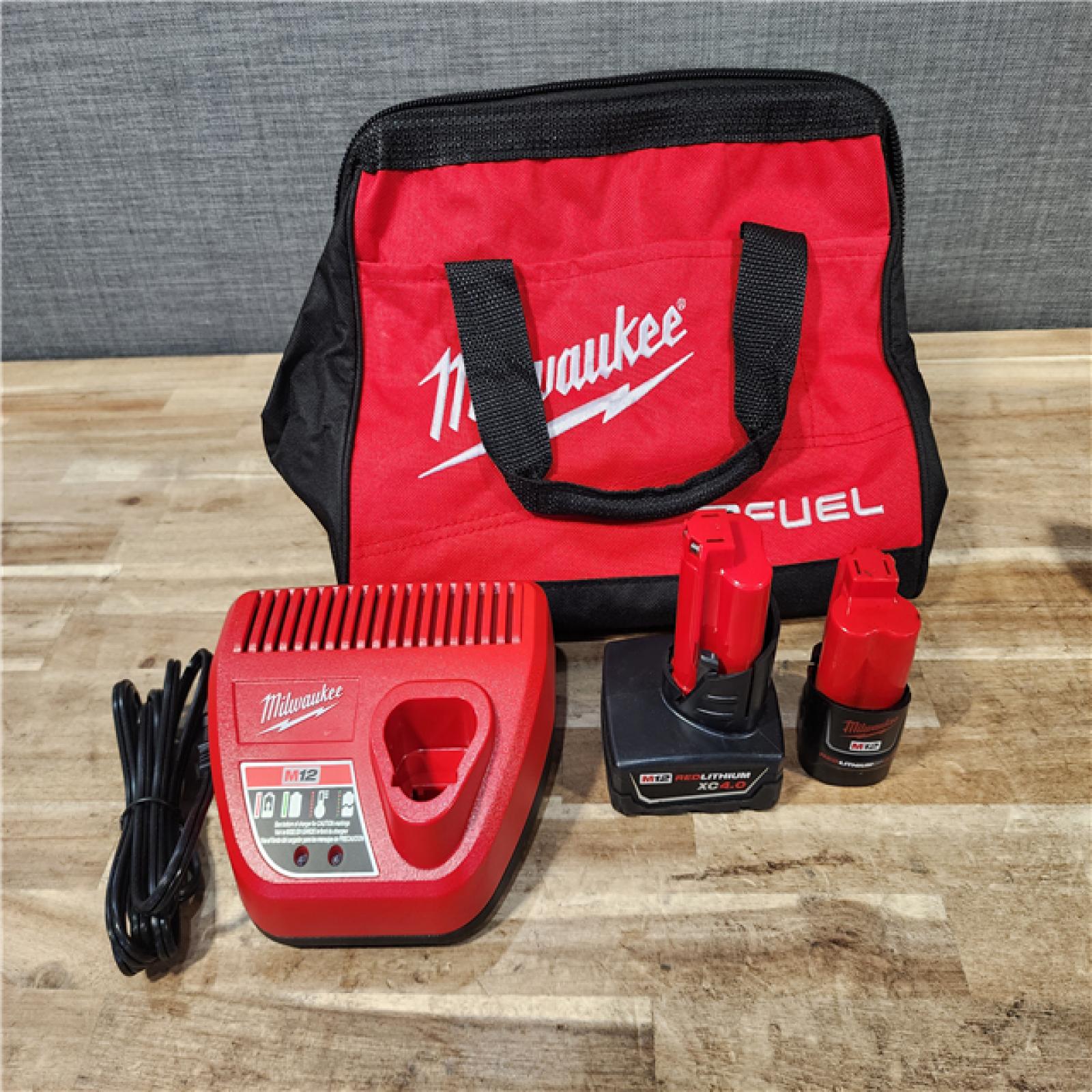 HOUSTON LOCATION - AS-IS Milwaukee FUEL 12-Volt Lithium-Ion Brushless Cordless Hammer Drill and Impact Driver Combo Kit