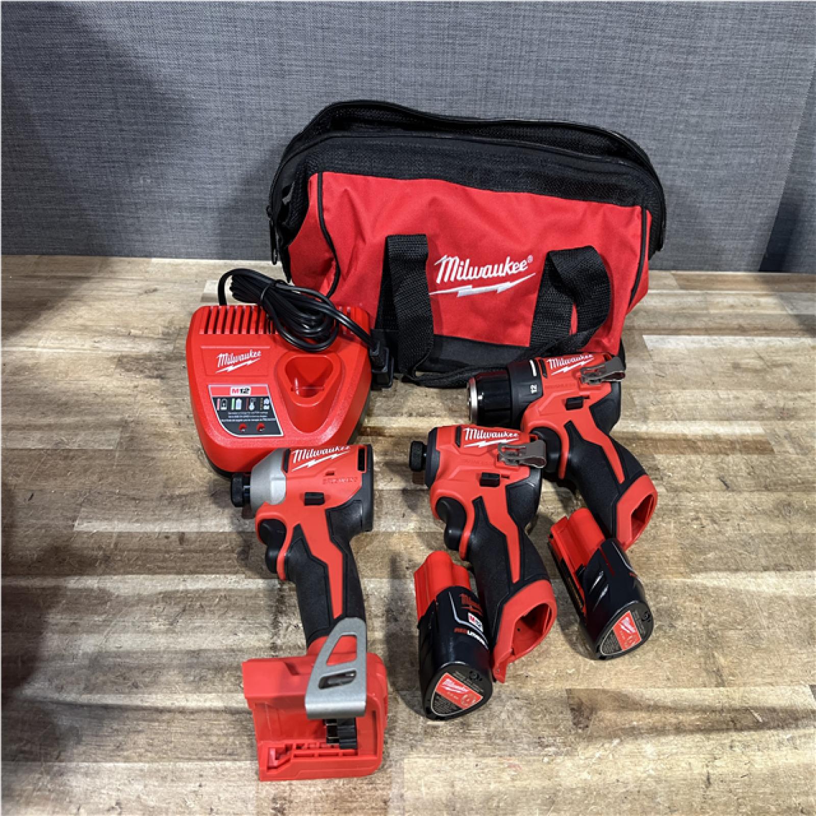 Houston Location AS-IS Milwaukee Drill Driver and Impact Drivers QTY/2 and Batteries with Charger