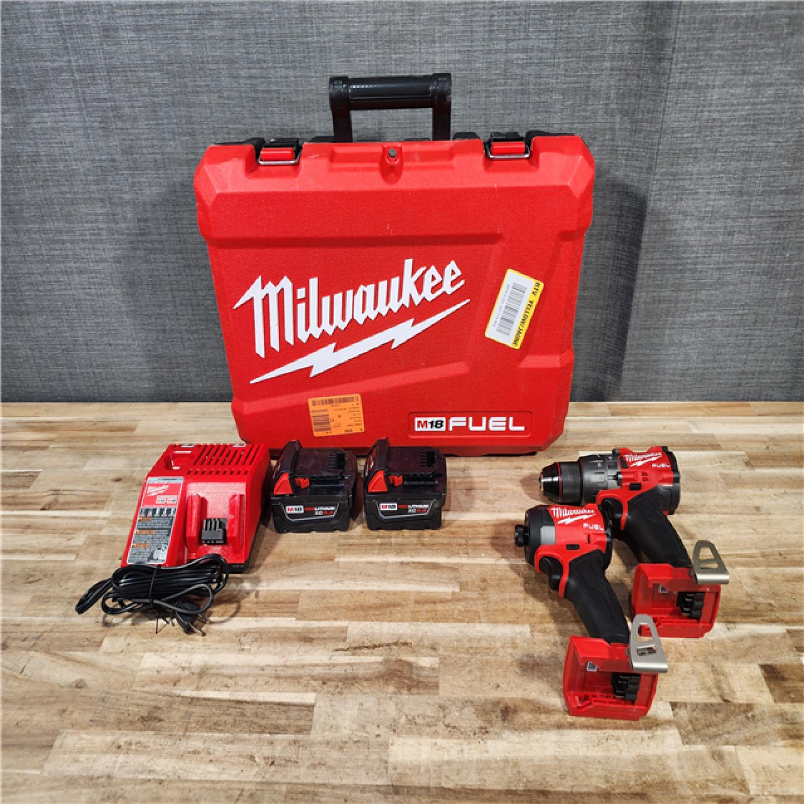 HOUSTON LOCATION - AS-IS Milwaukee FUEL 18V Lithium-Ion Brushless Cordless Hammer Drill and Impact Driver Combo Kit