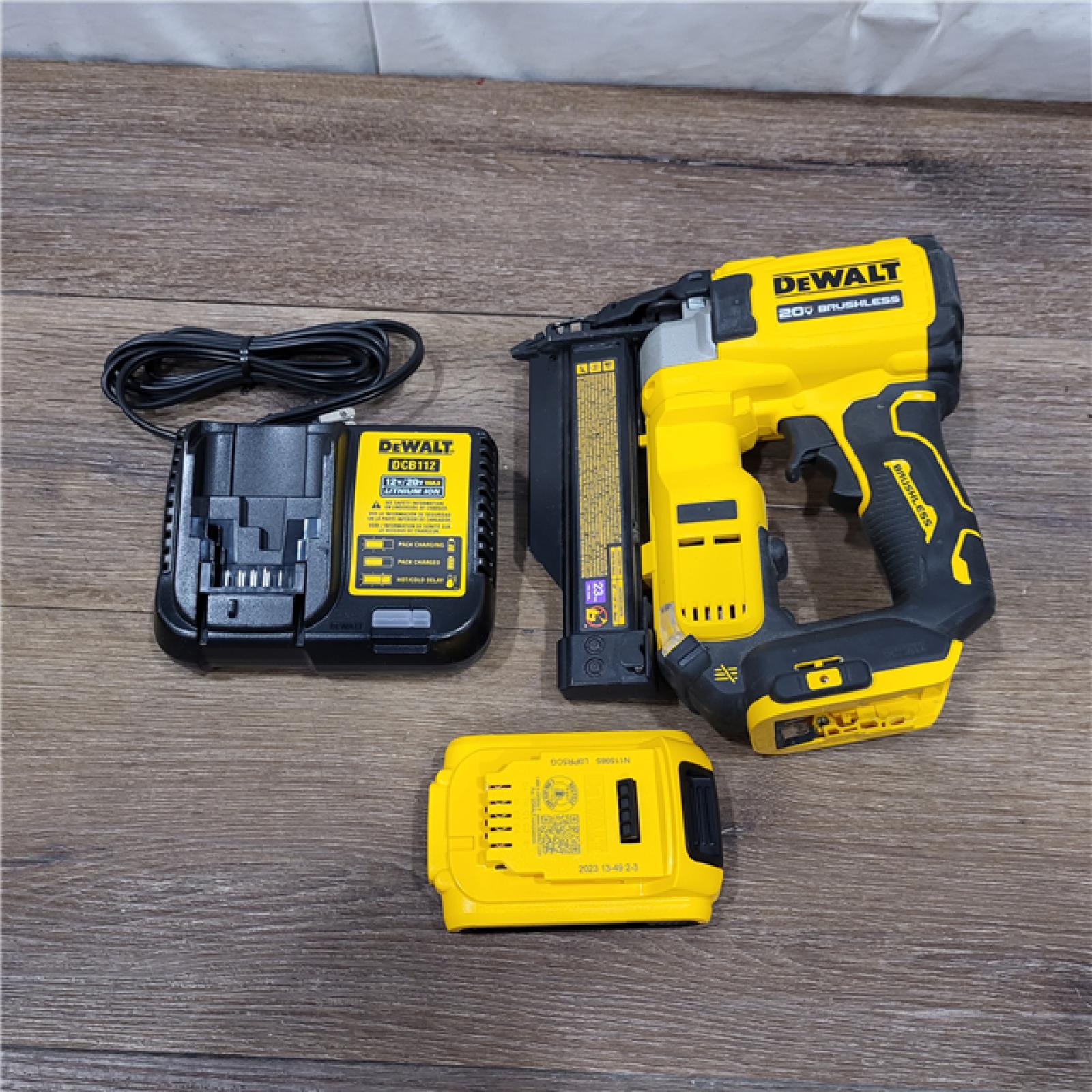 AS-IS DEWALT ATOMIC 20V MAX Lithium Ion Cordless 23 Gauge Pin Nailer Kit with 2.0Ah Battery and Charger