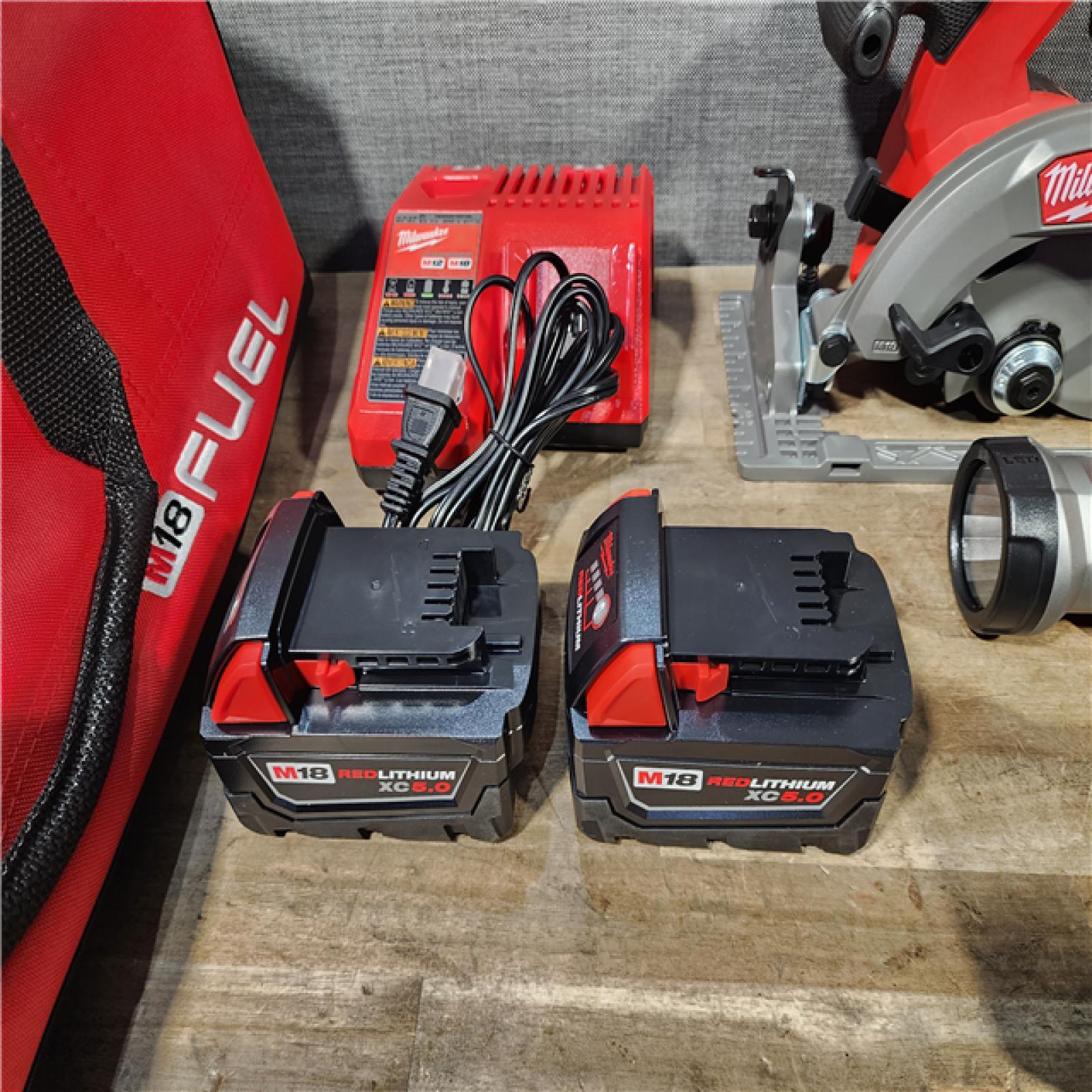 HOUSTON LOCATION - AS-IS (APPEARS LIKE NEW) M18 FUEL 18V Lithium-Ion Brushless Cordless 5-Tool Combo Kit with Two 5.0 Ah Batteries  1 Charger 1 Tool Bag